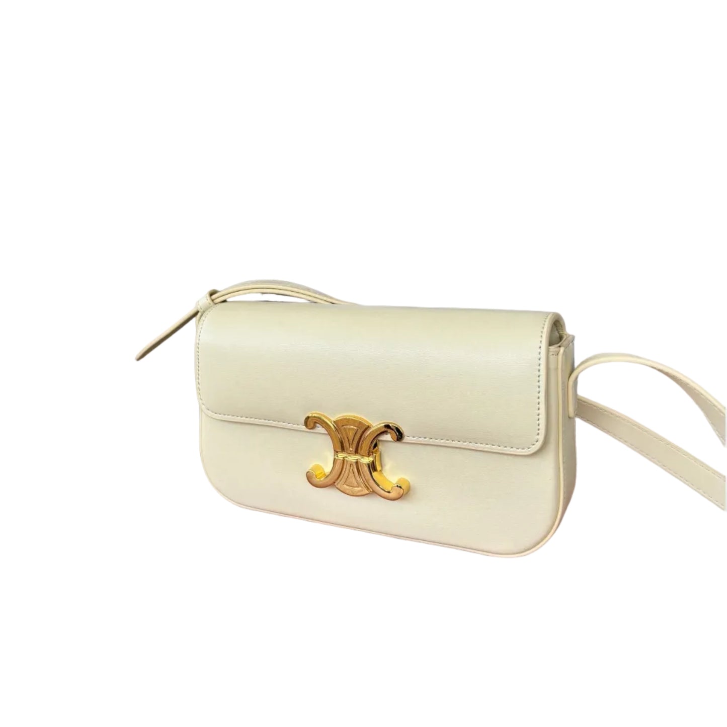 A cream-colored crossbody bag with a gold-tone emblem and a sleek strap, showcasing a minimalist design.