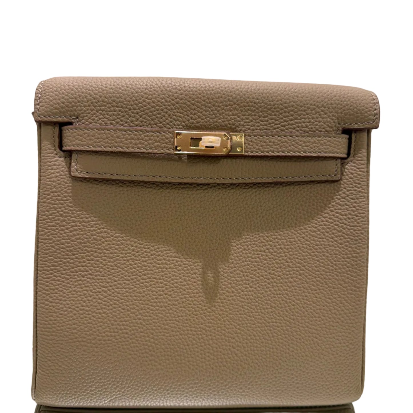Brown leather handbag with a gold clasp on a light gray background