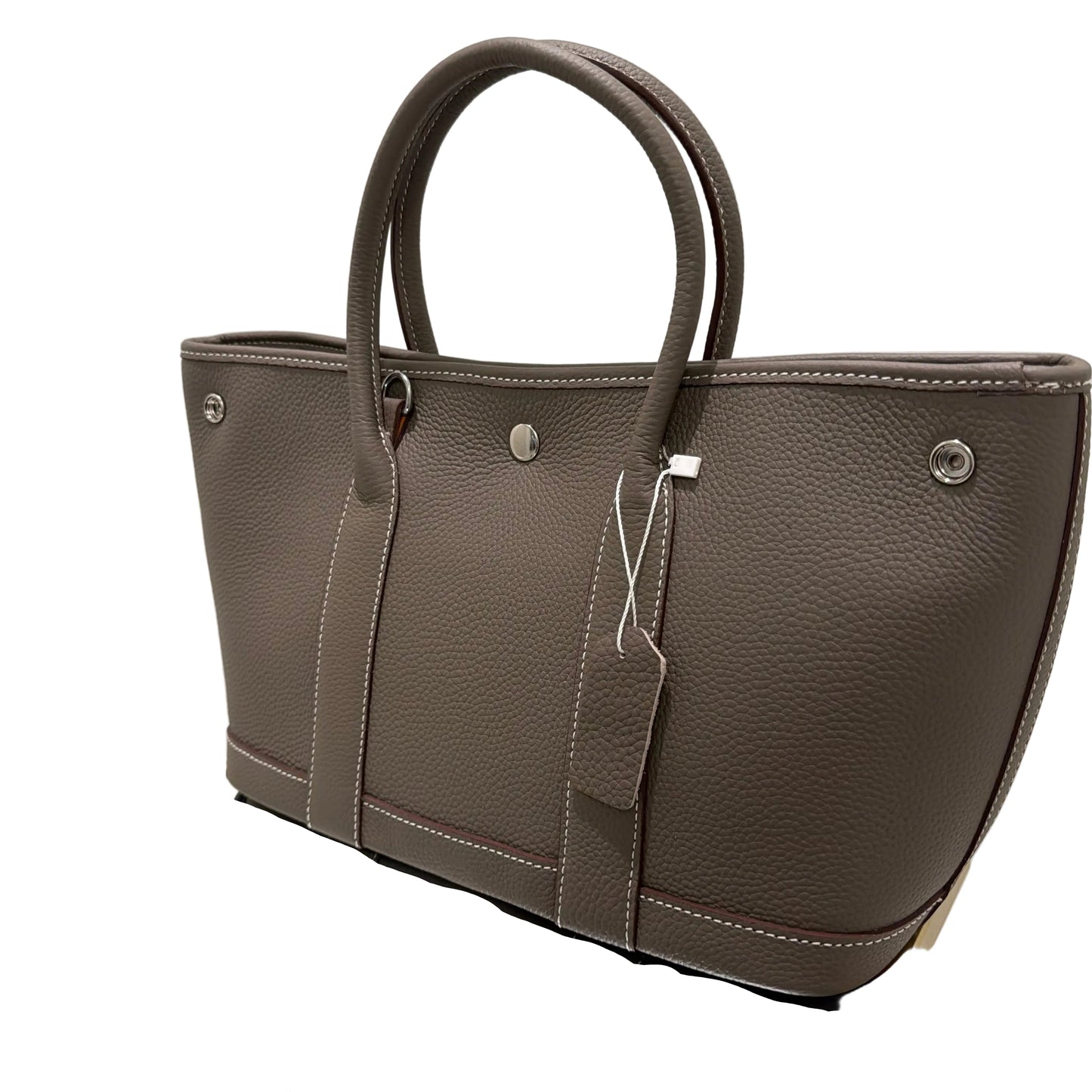 Brown leather briefcase on a reflective surface