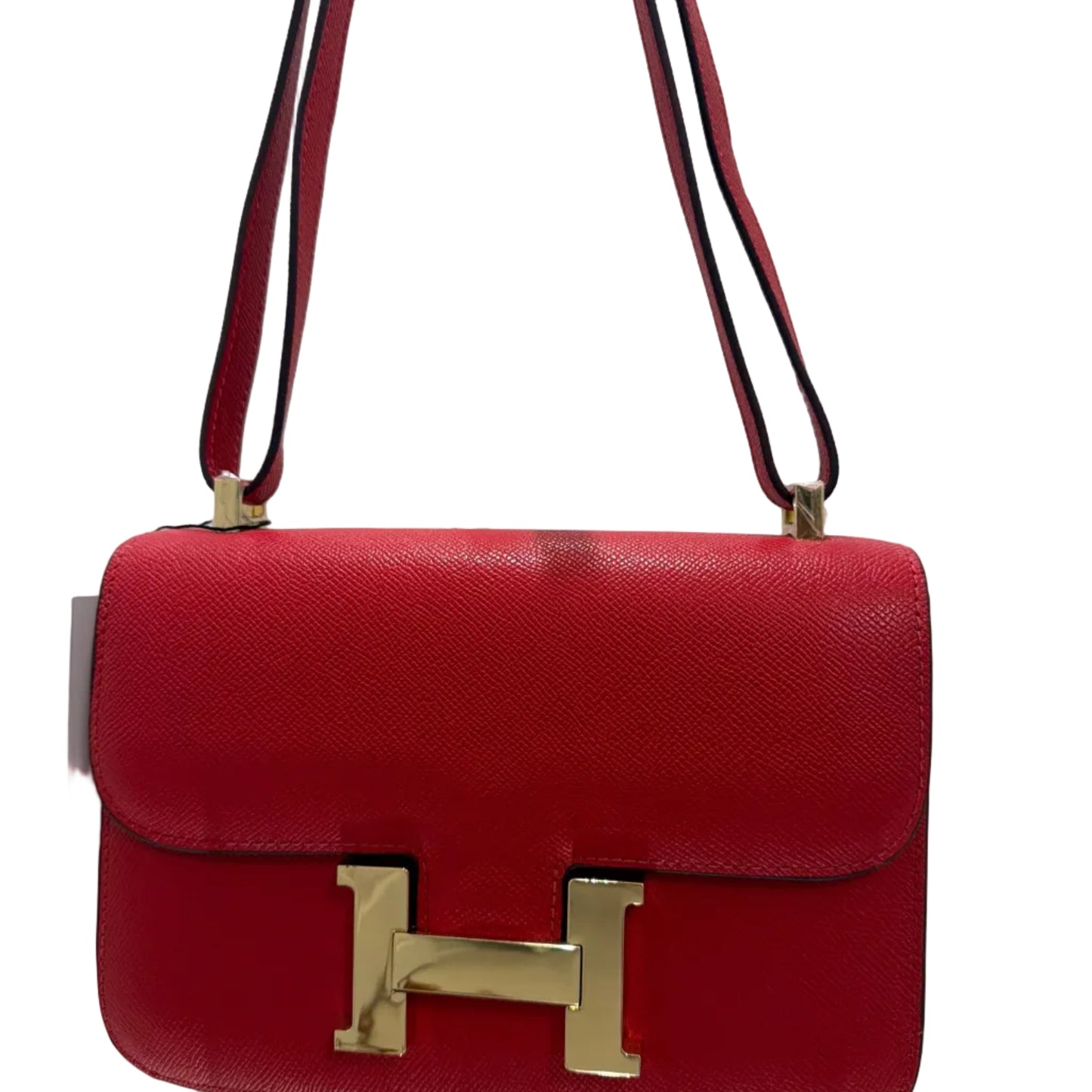 Red handbag with gold clasp on a white background