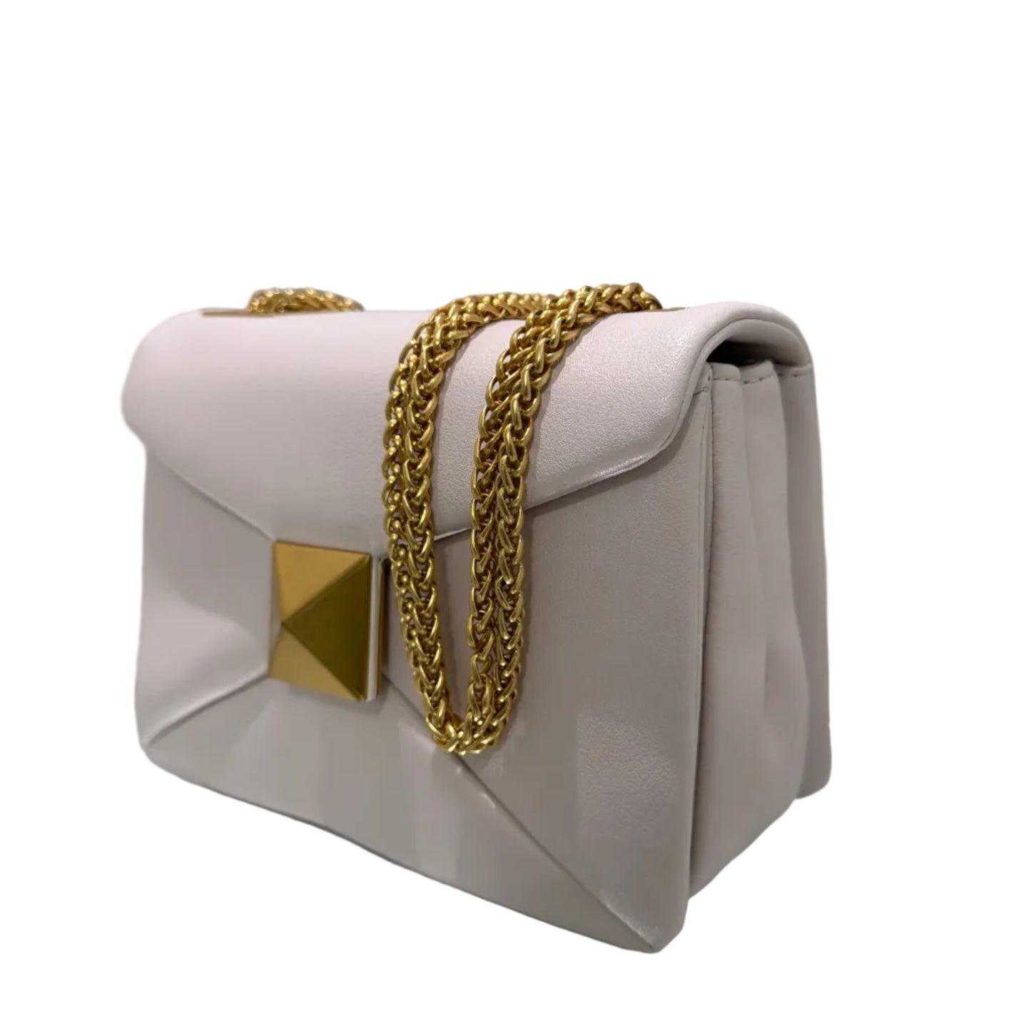 White handbag with gold chain and accents on a light gray background