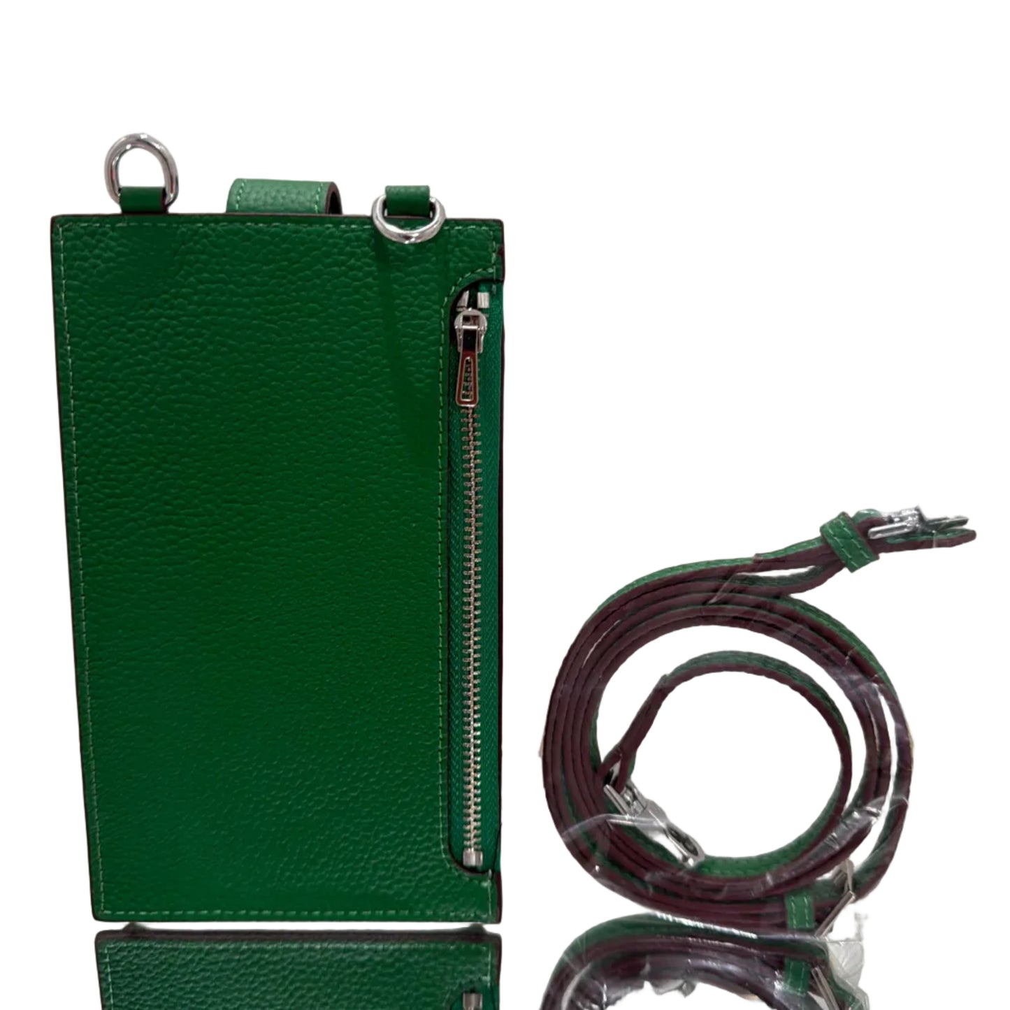 Green leather wallet with strap on a light gray background
