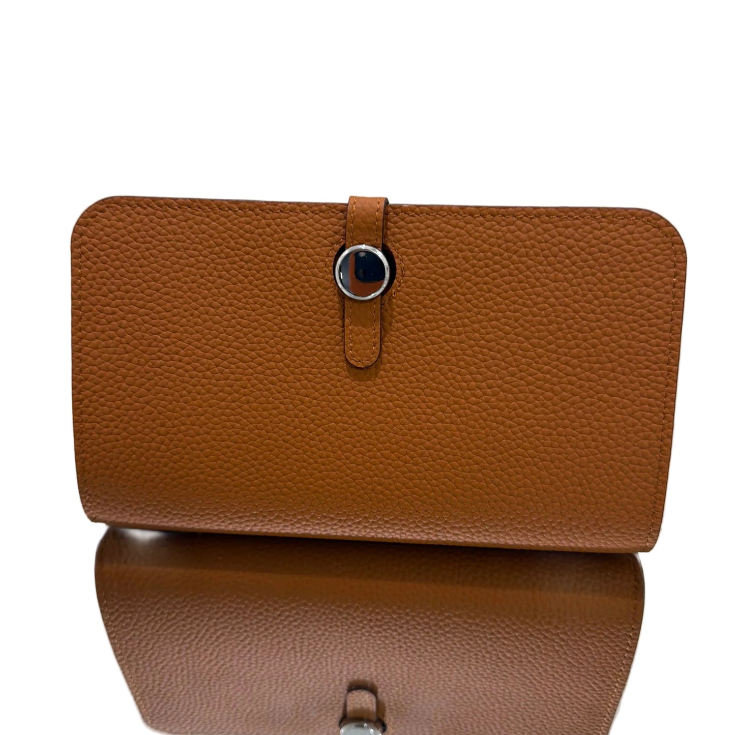 Brown leather wallet on a light gray background