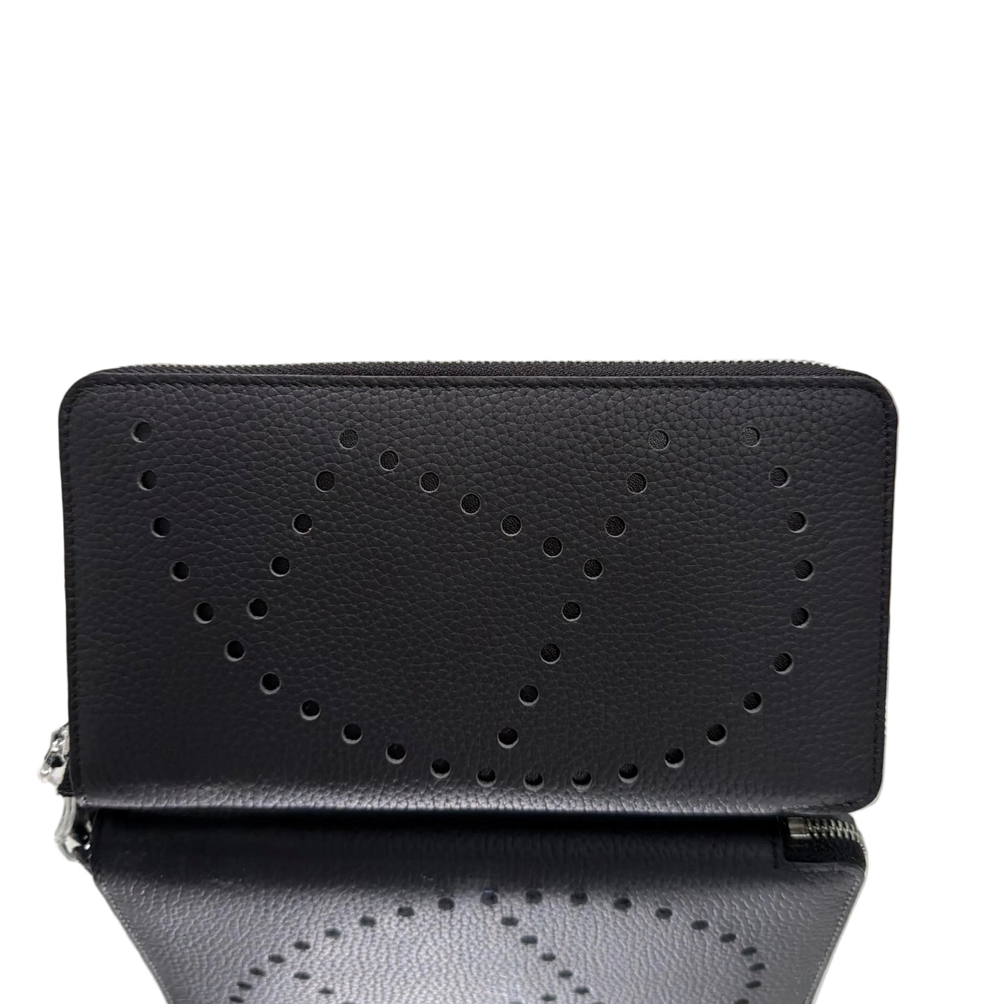 Black leather wallet with perforated design on a light gray background