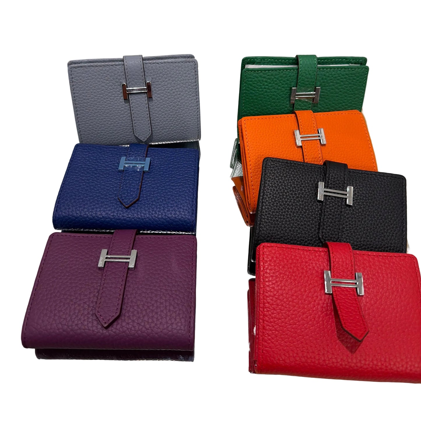 Set of colorful leather wallets displayed on a stand.