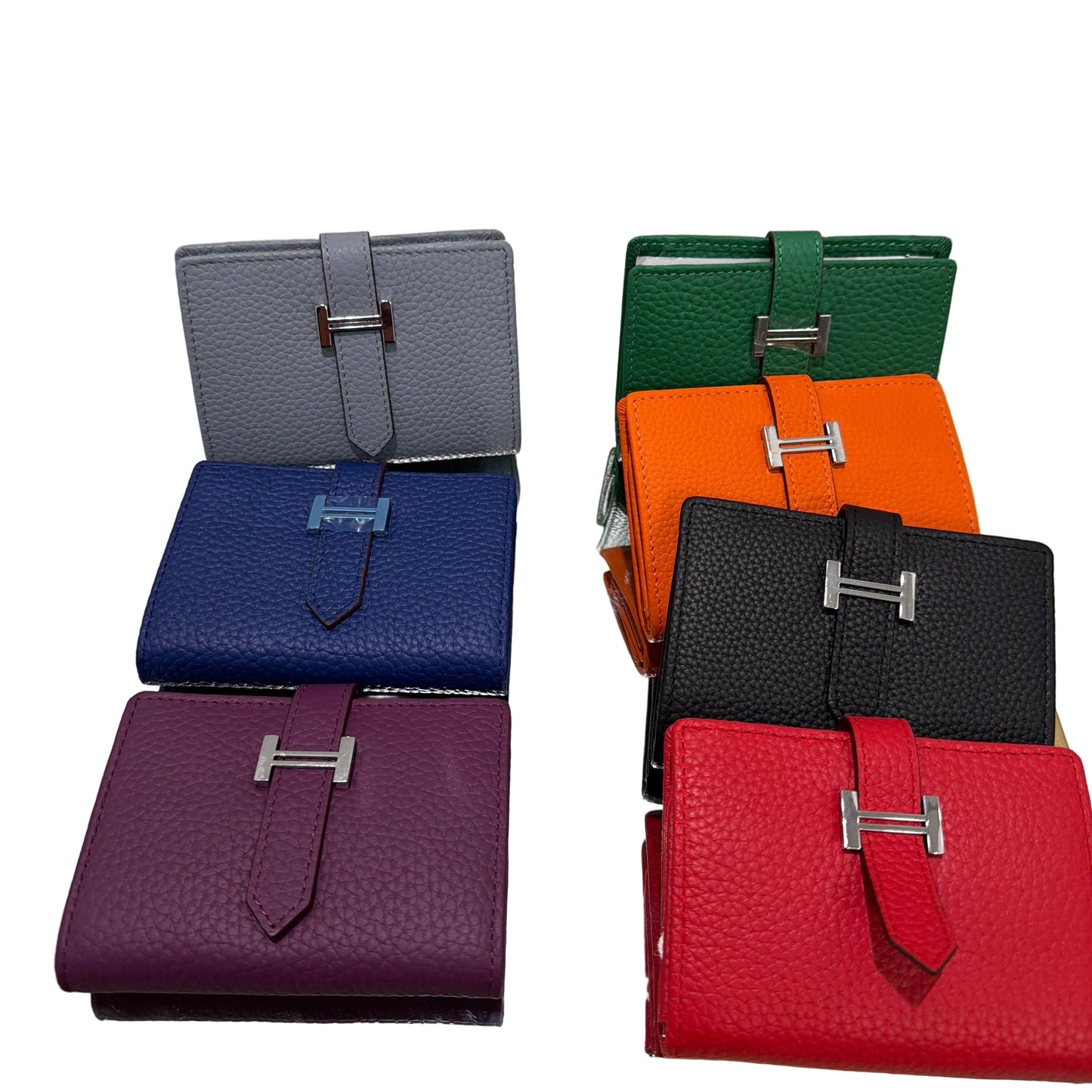 Set of colorful leather wallets displayed on a stand.