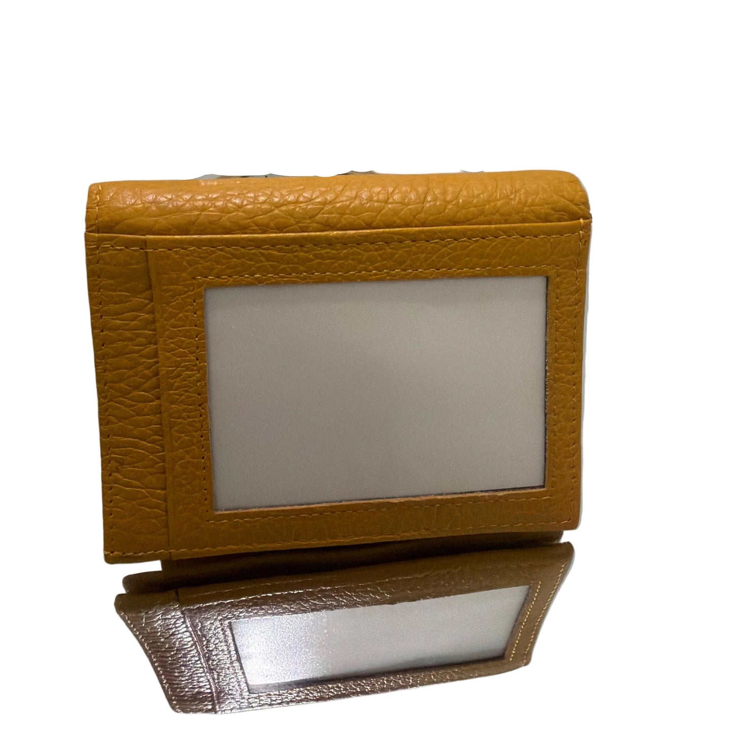 Two brown textured picture frames on a white surface