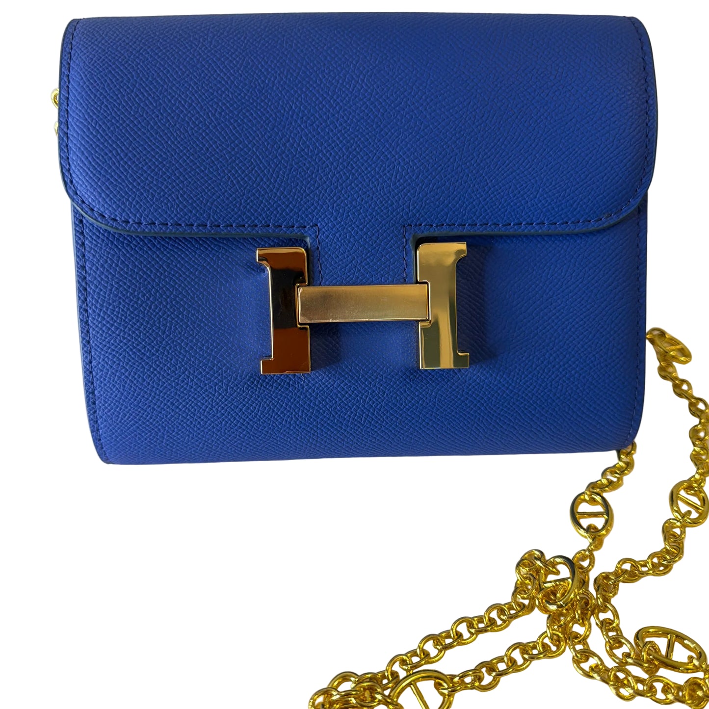 Blue handbag with gold chain on a white background