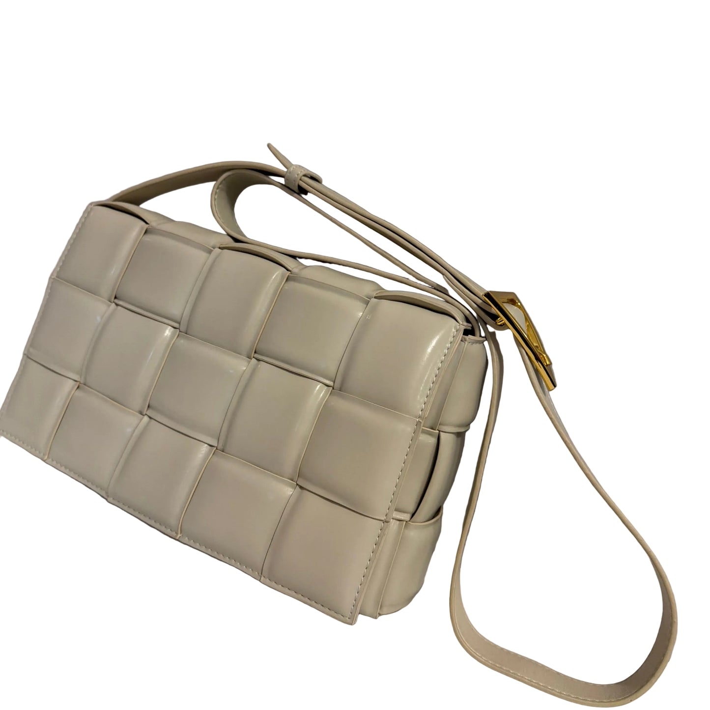 Beige woven handbag on a light gray background