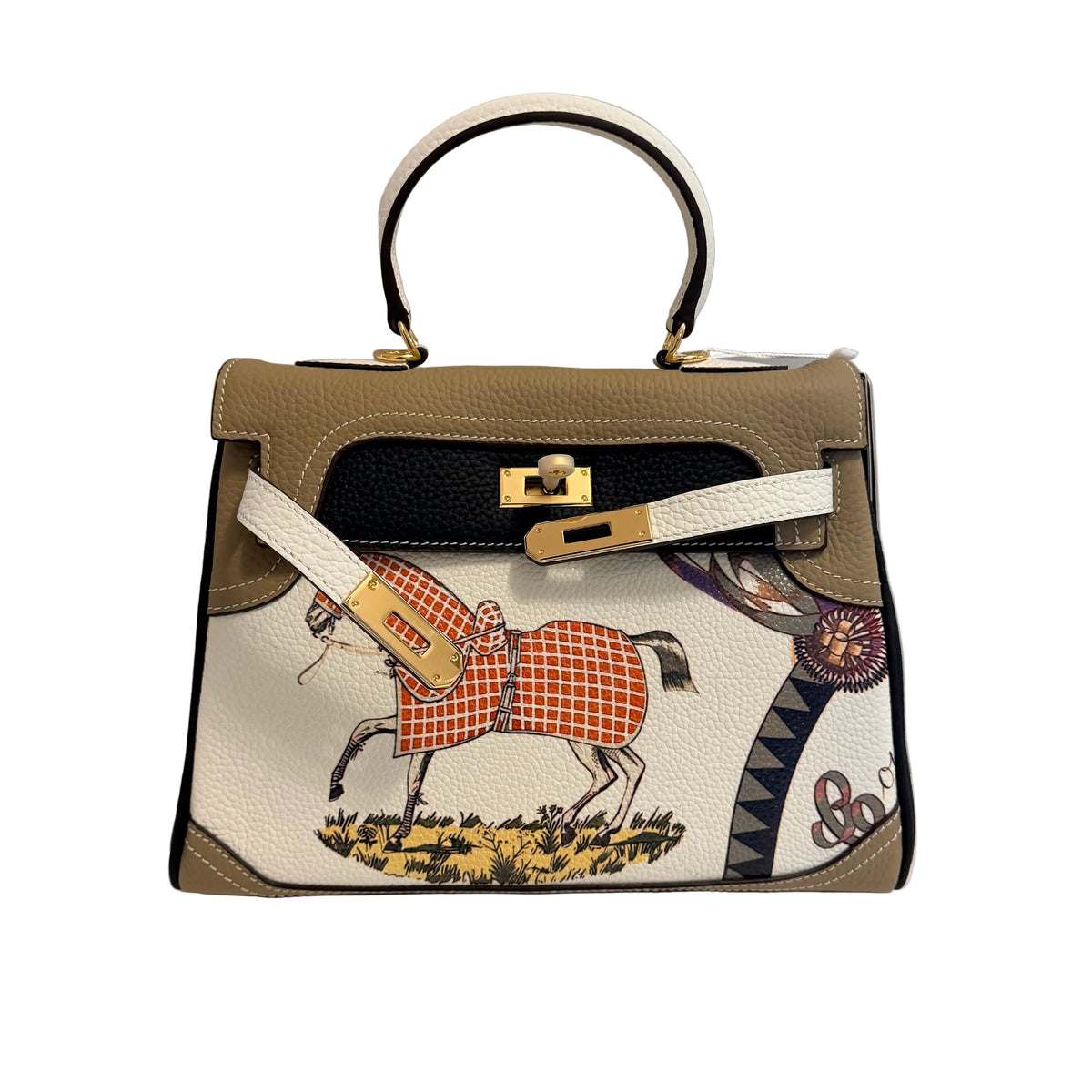 An Hermes Kelly handbag in beige and white leather with the brand's signature horse print, gold-tone hardware, and a top handle, displayed on a white surface against a gray background.