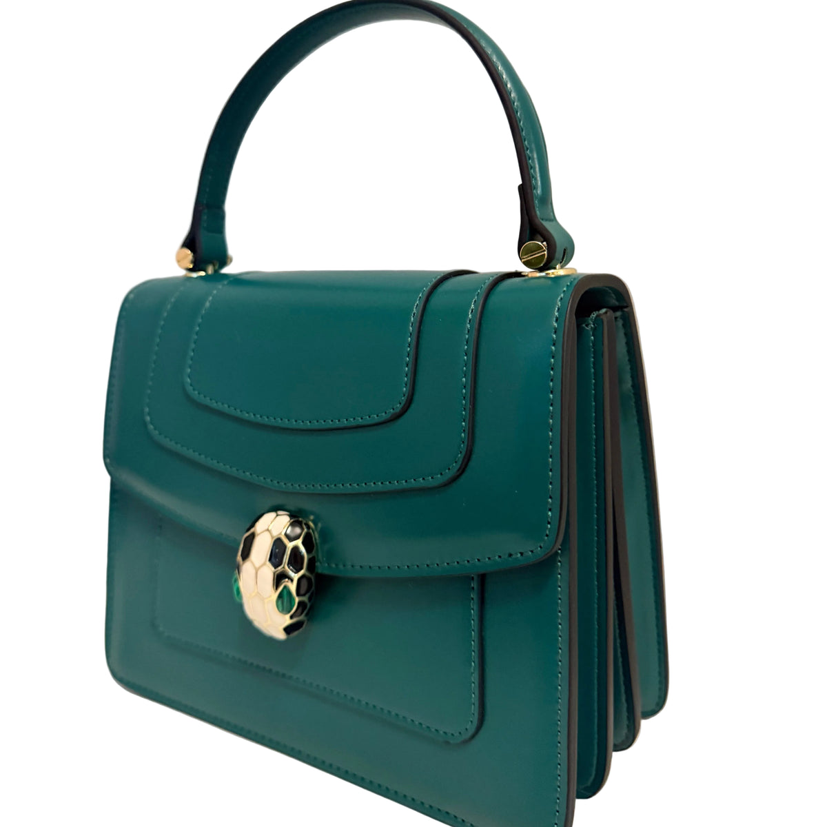 A teal green leather handbag with a top handle and a distinctive gold snake-head clasp, displayed on a white surface against a light gray background.
