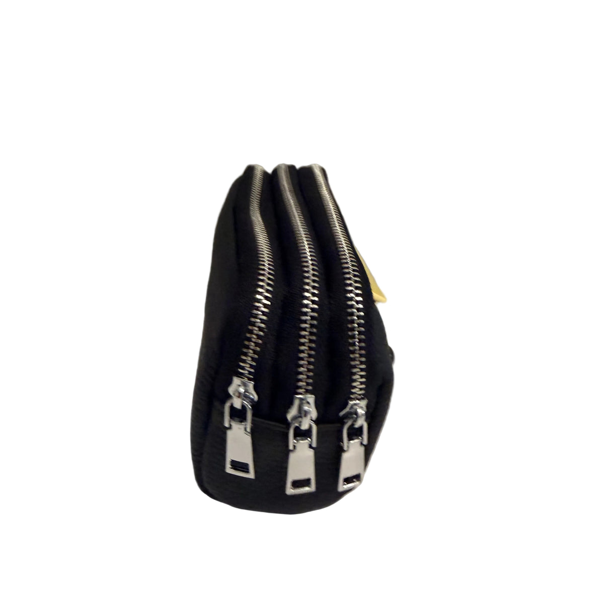 A black zippered pouch with three silver metal zippers and pull tabs, standing upright on a white surface against a light gray background.
