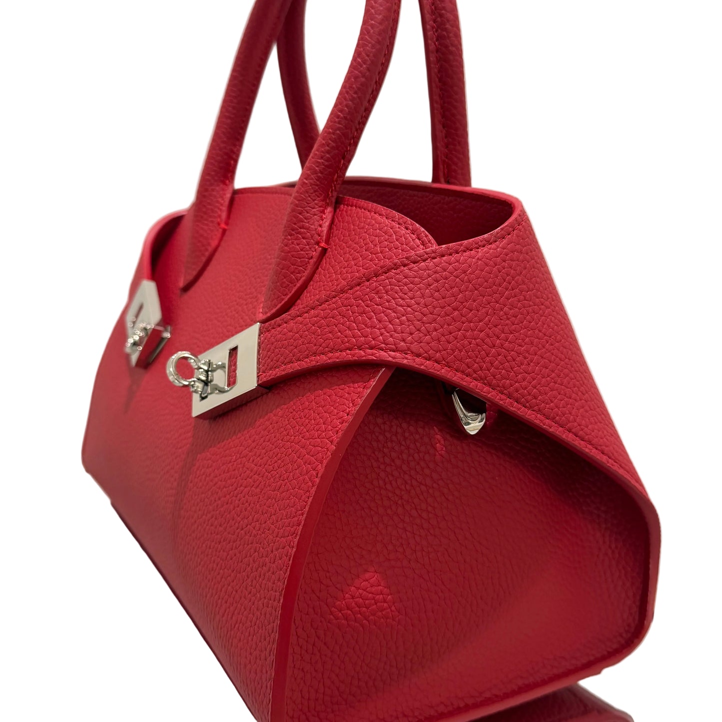 Red handbag with a visible brand logo on a light background