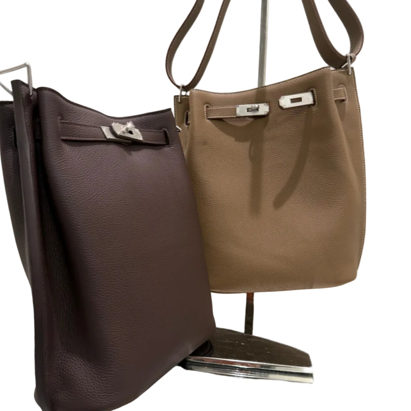 Brown leather bag on a chair with a white background