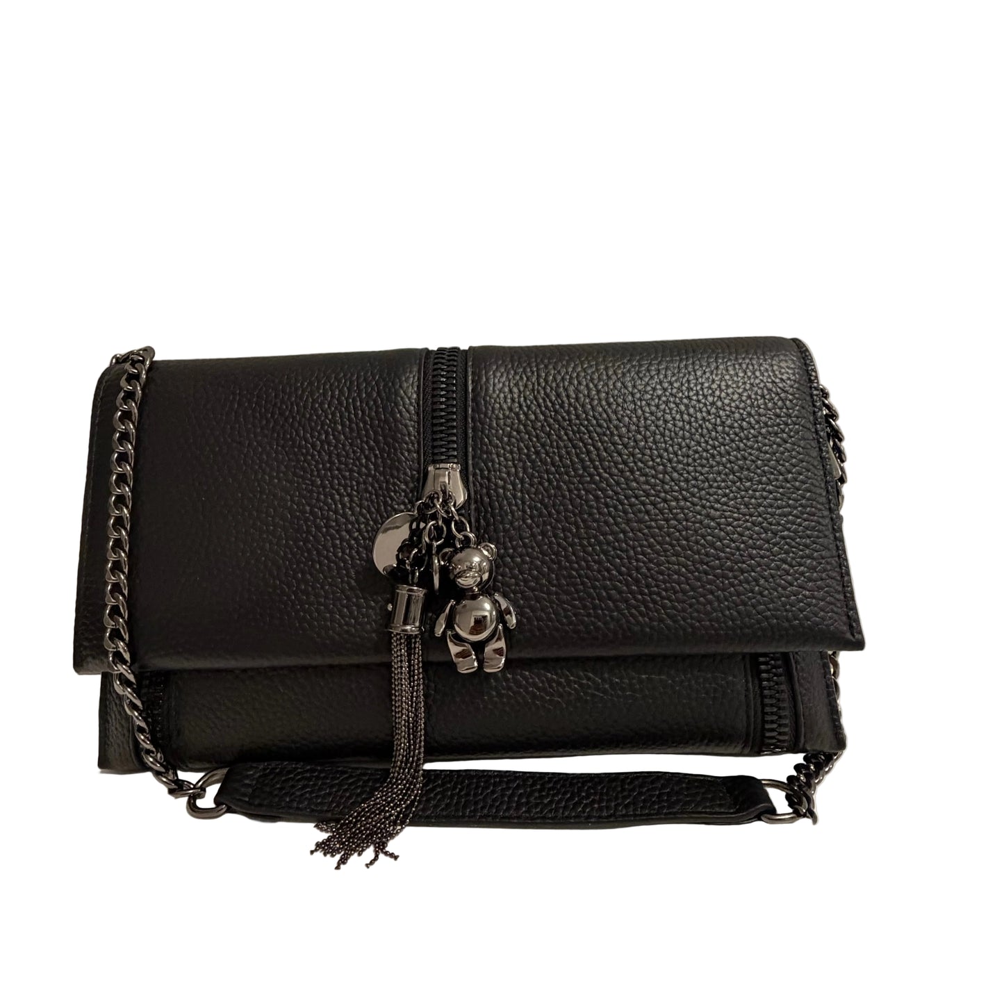 Black leather handbag with a teddy bear charm on a neutral background