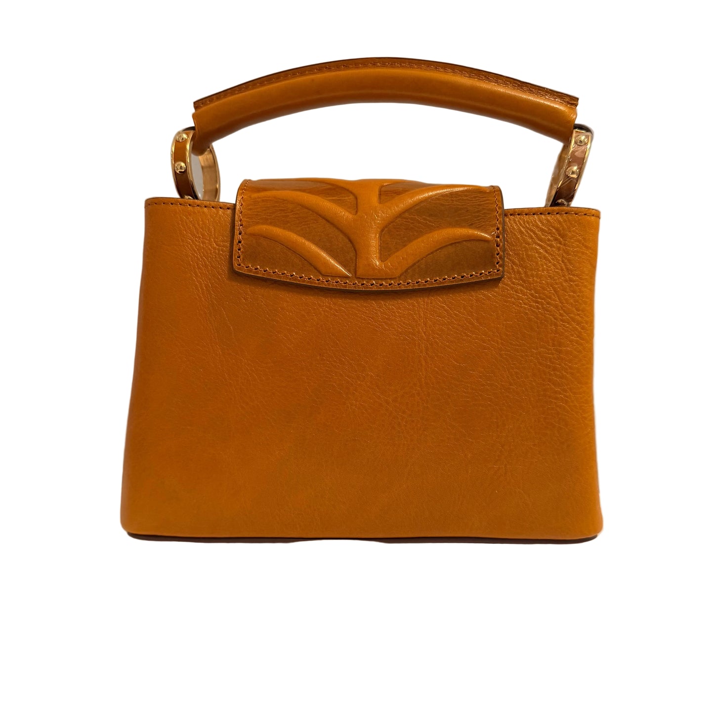 Brown leather handbag with a decorative clasp on a neutral background