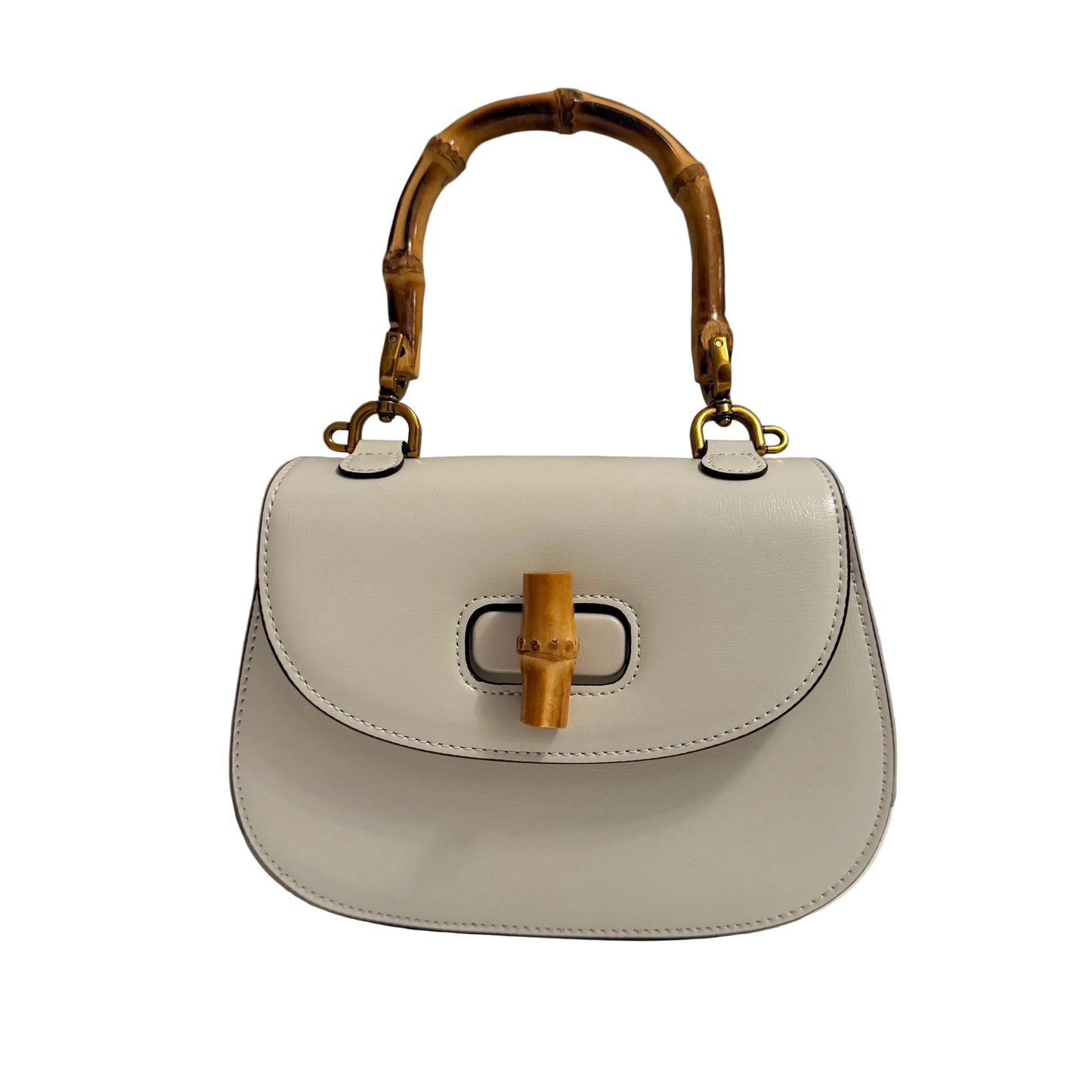 White handbag with wooden handle and accents on a gray background