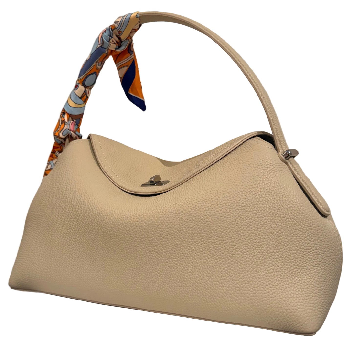 Beige handbag with a colorful handle on a neutral background