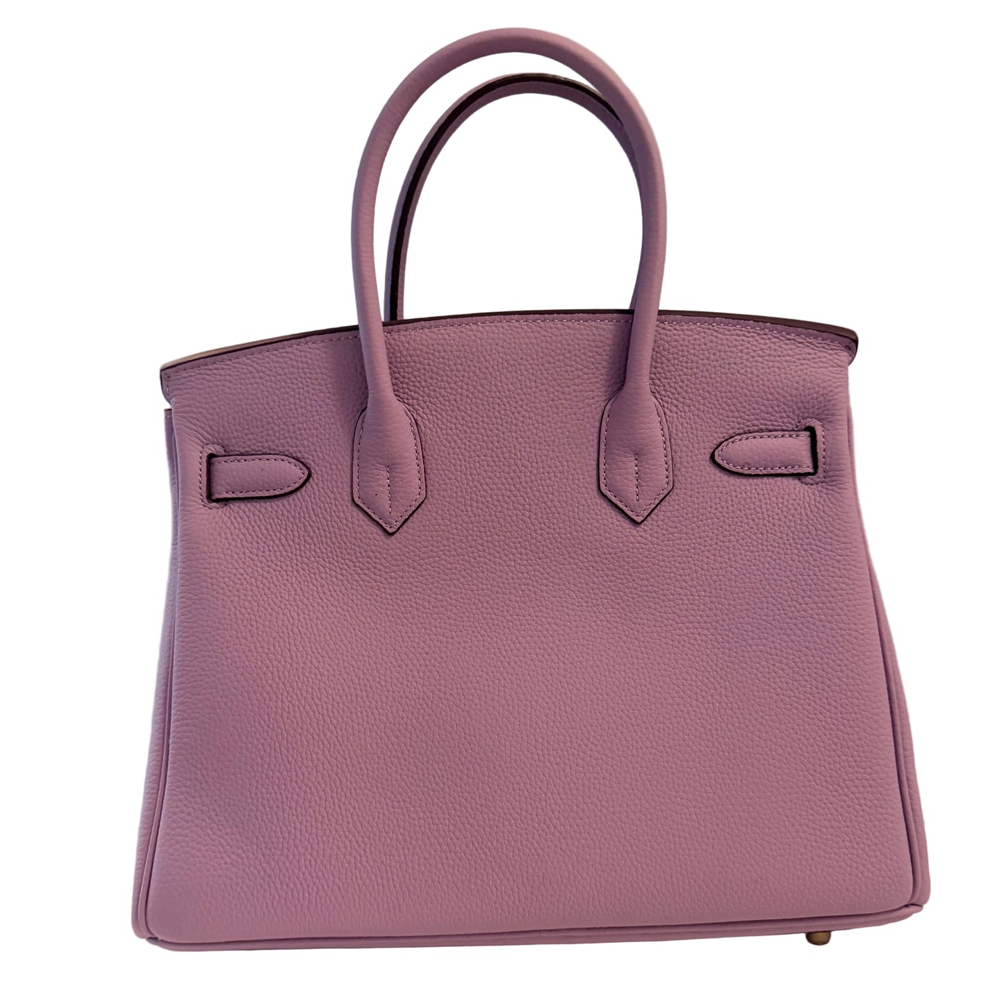 Purple handbag on a white surface with a gray background