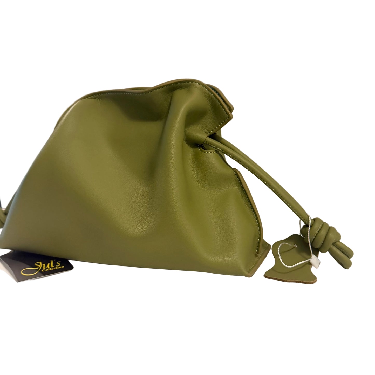 Green drawstring bag on a white surface with a gray background
