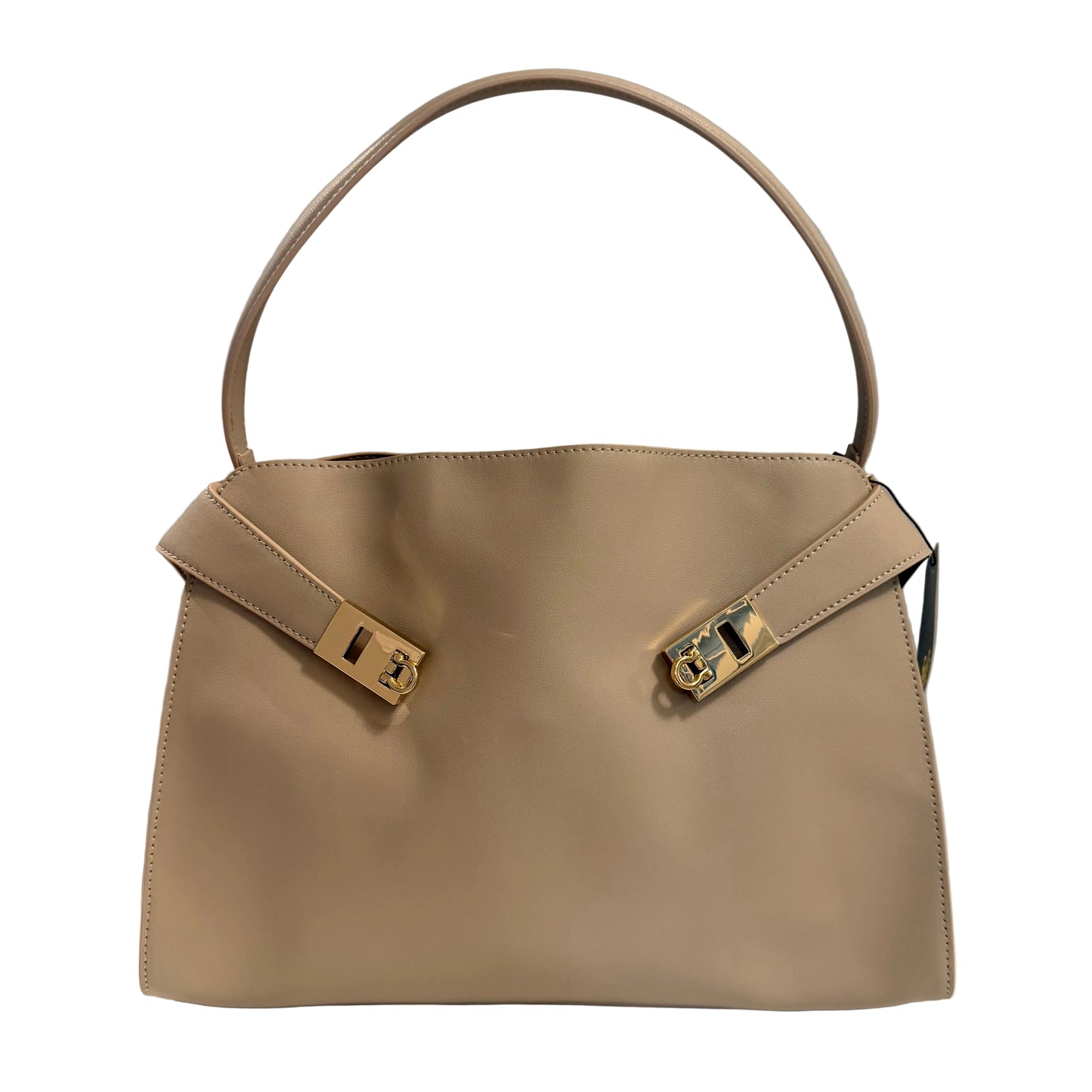 Beige handbag with gold hardware on a gray background