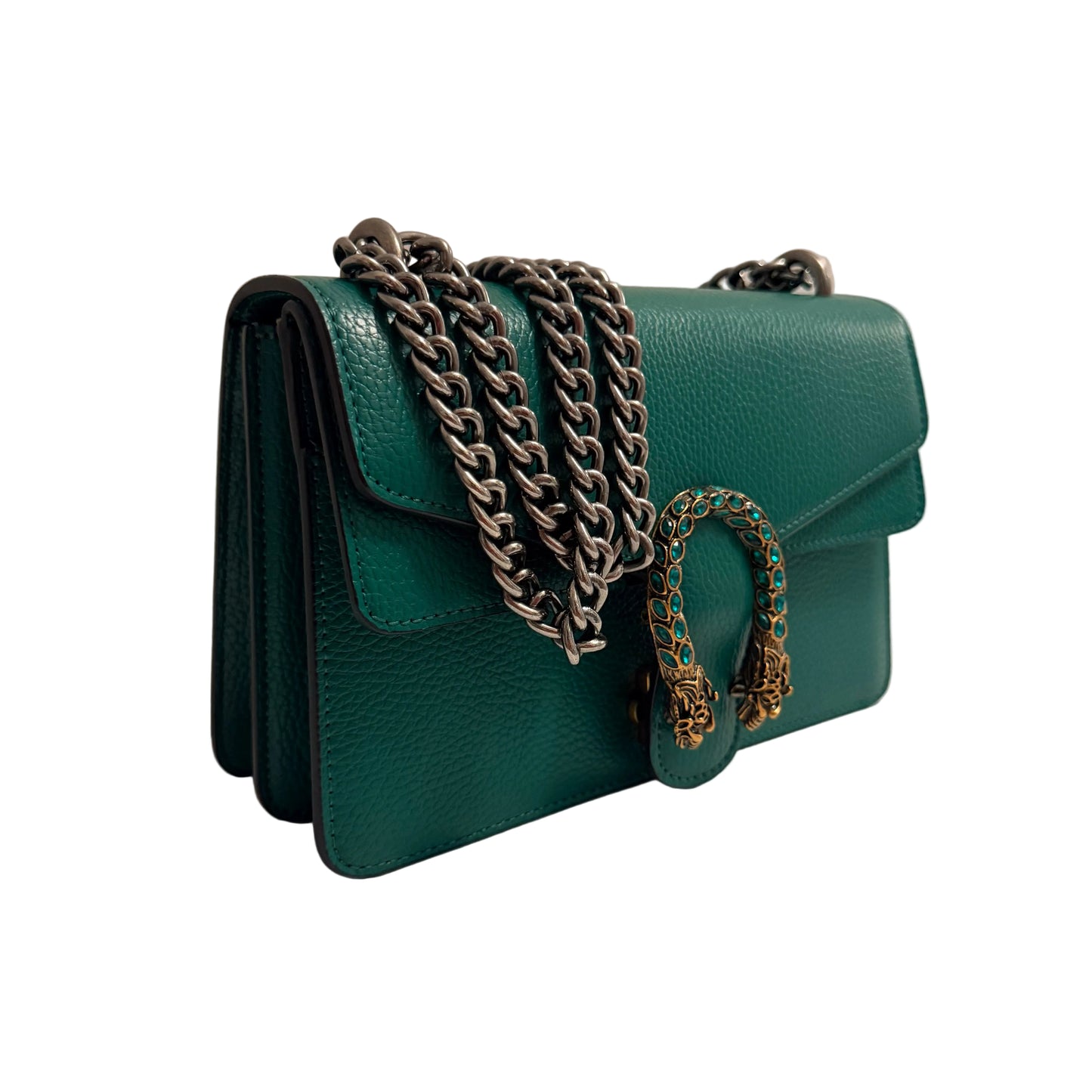 Green handbag with chains on a neutral background