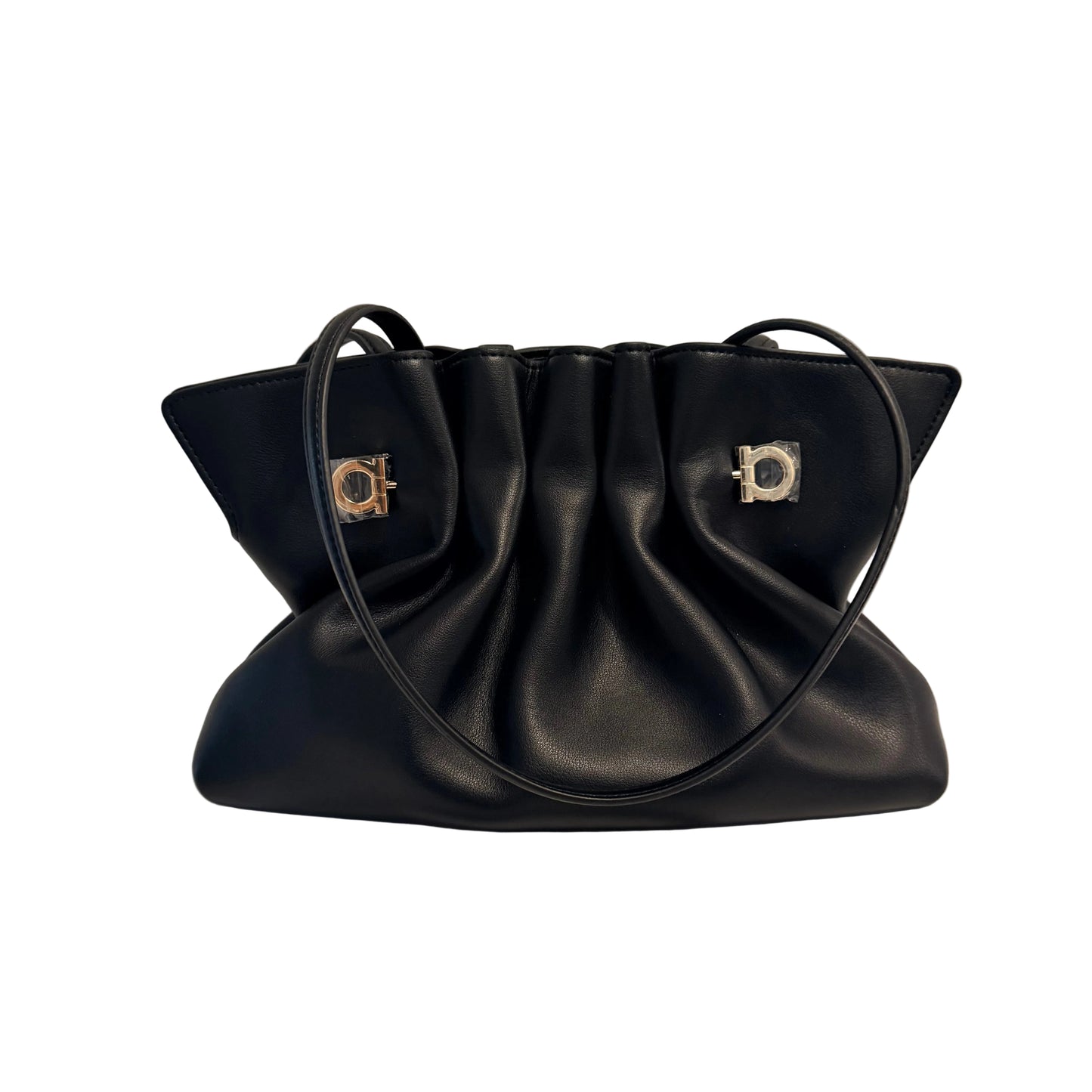 A black leather shoulder bag with a gathered, pleated design and two silver-tone metal accents on the front, resting on a white surface against a light gray background.