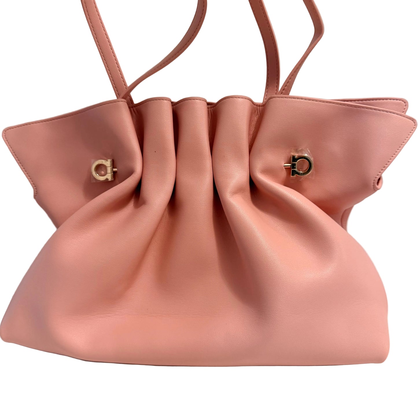 A dusty pink leather handbag with a gathered, slouchy silhouette, dual shoulder straps, and gold-tone hardware on a plain light gray background.