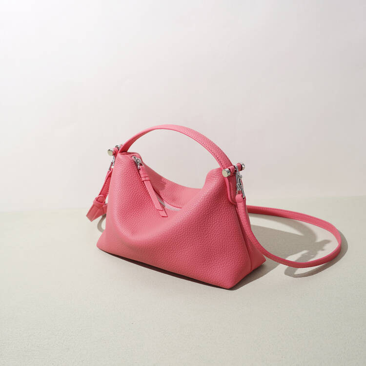 Pink handbag on a light beige background