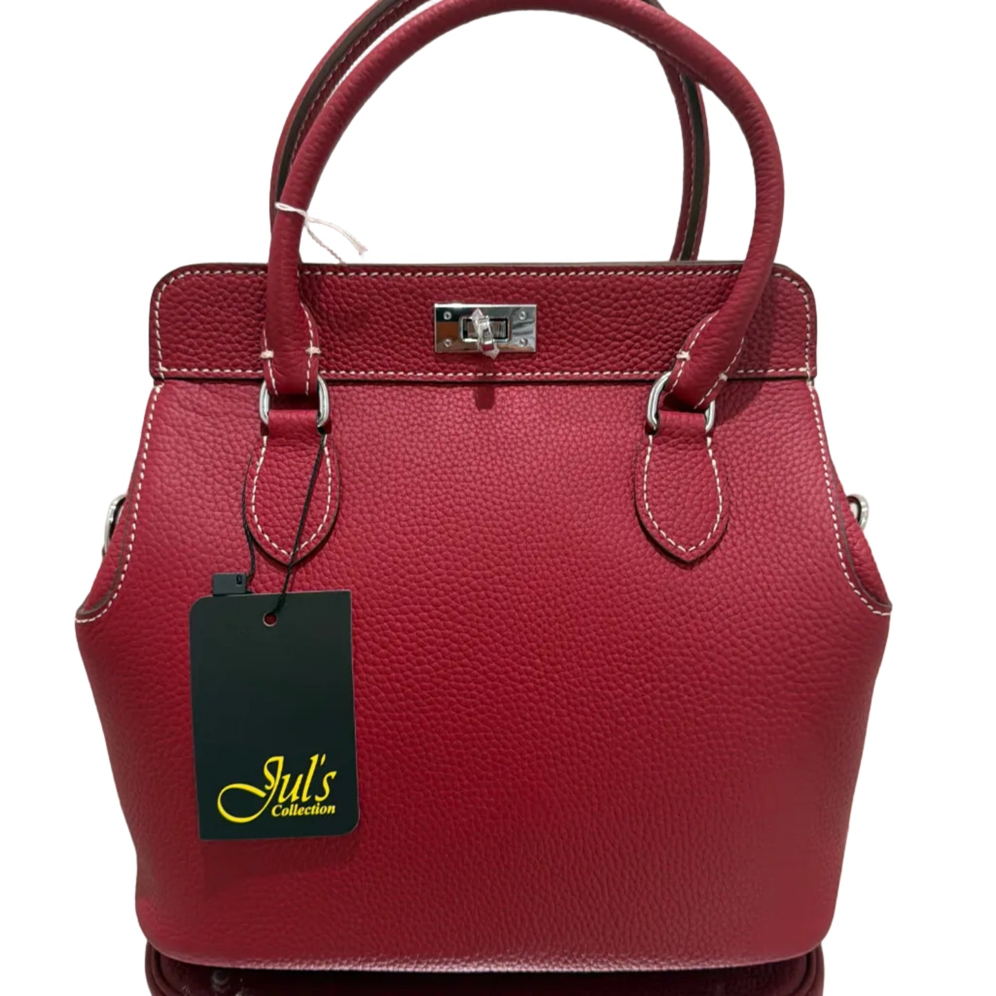 Red handbag with a visible brand tag on a light background