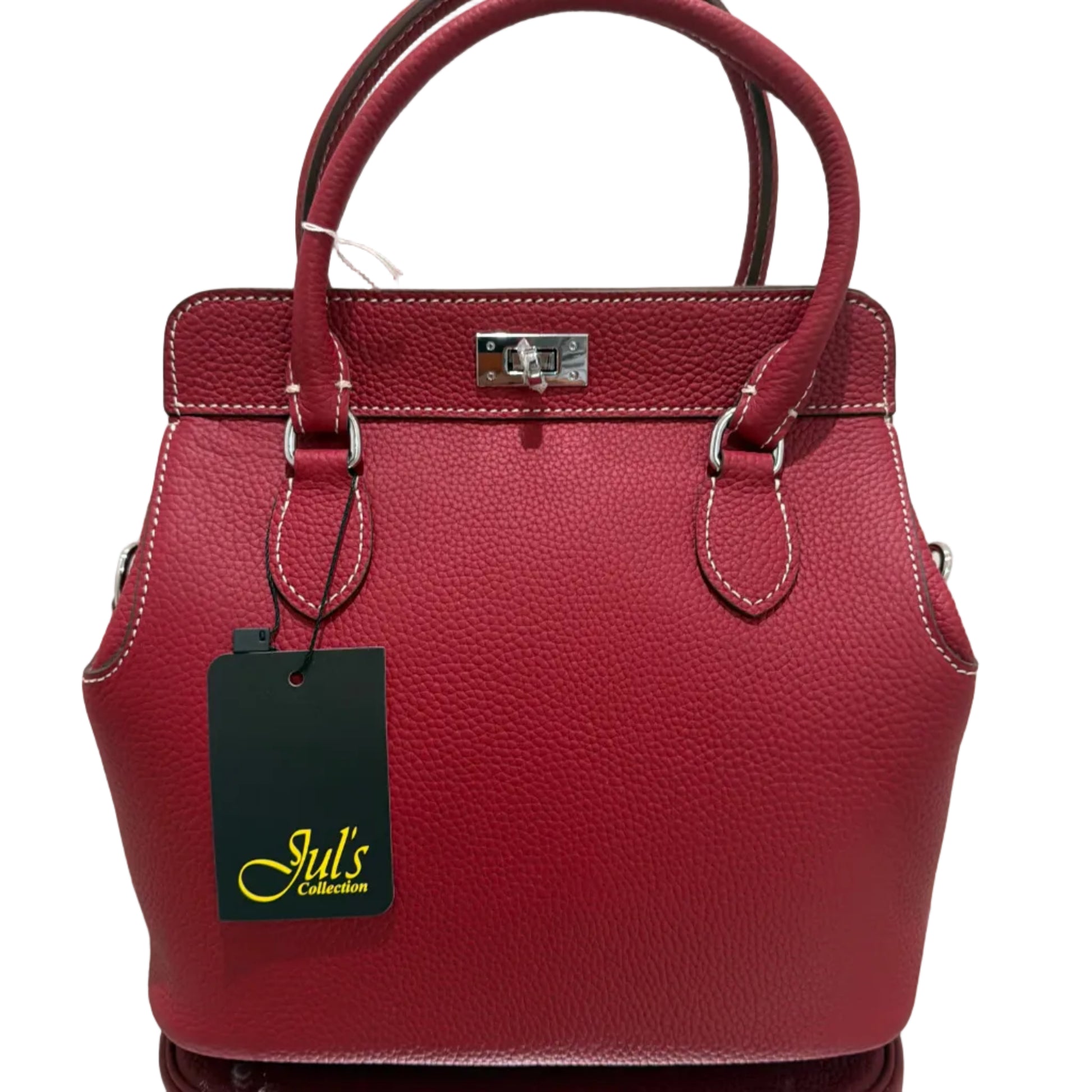 Red handbag with a visible brand tag on a light background