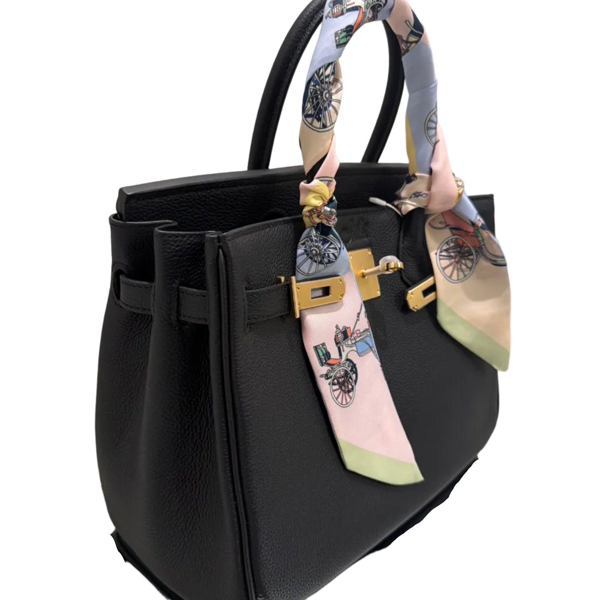 Black handbag with floral handle on a white background