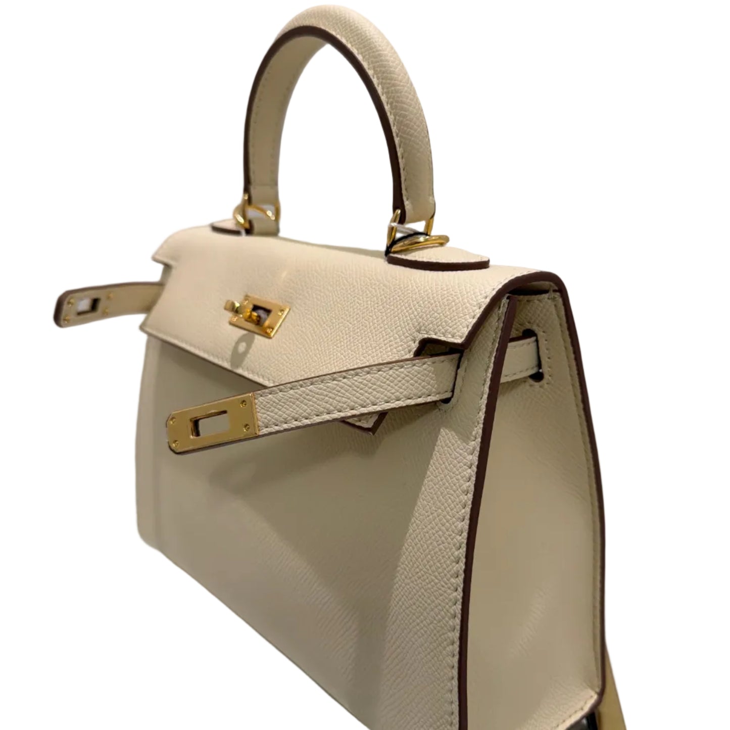 Beige handbag with gold accents on a light gray background