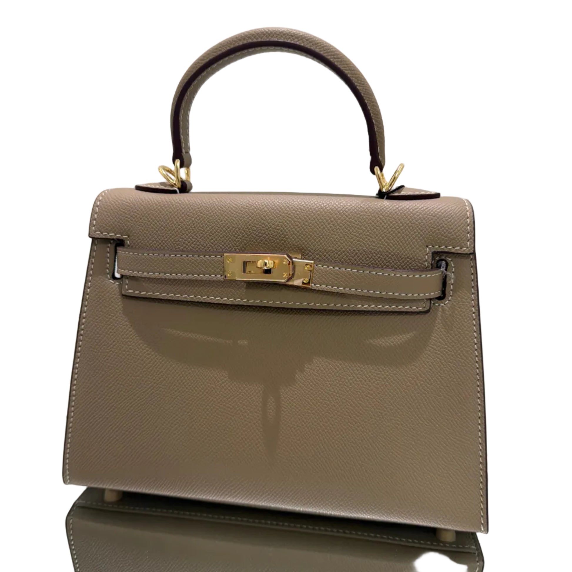 Beige handbag with gold clasp on a light gray background