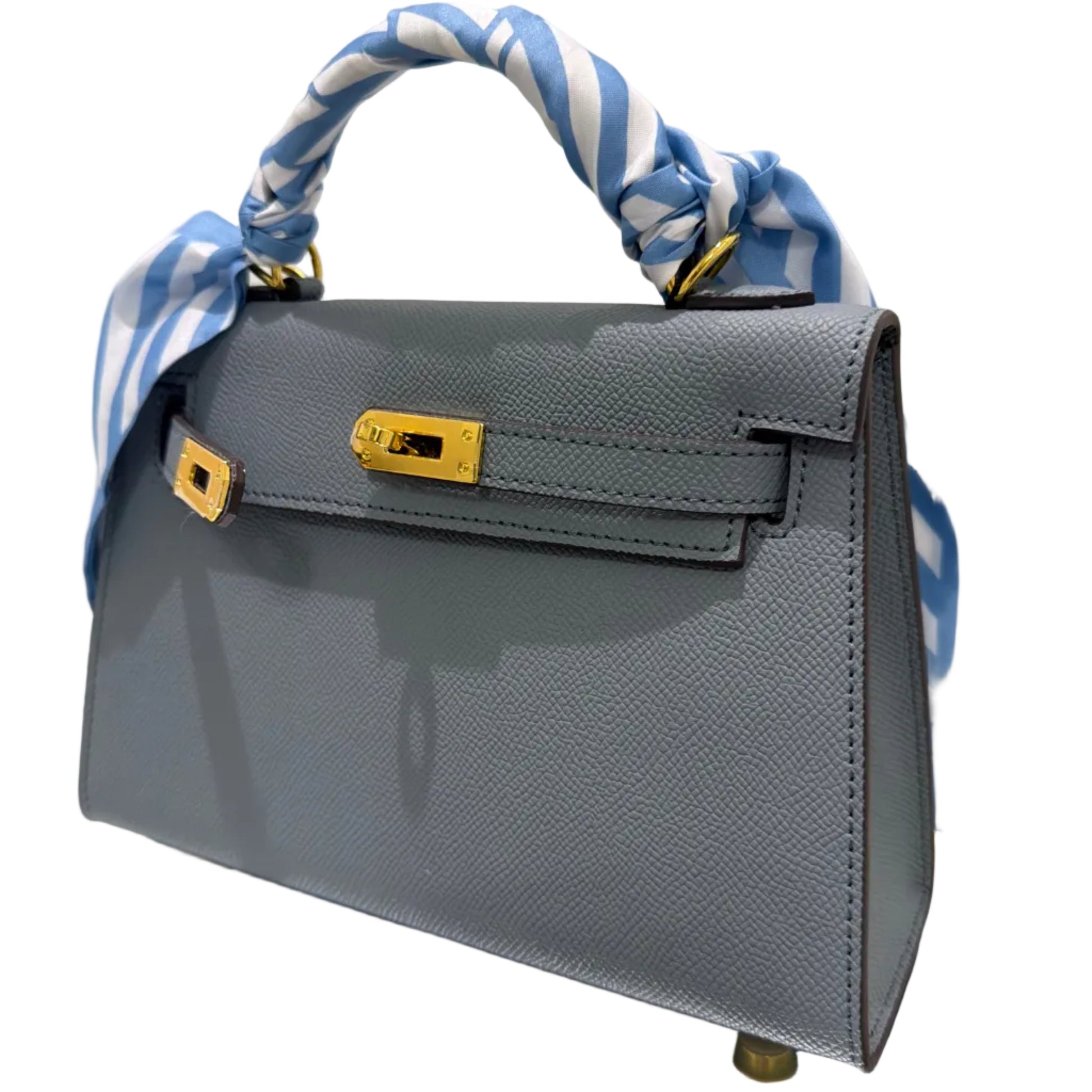 Gray handbag with a blue and white striped strap on a light background