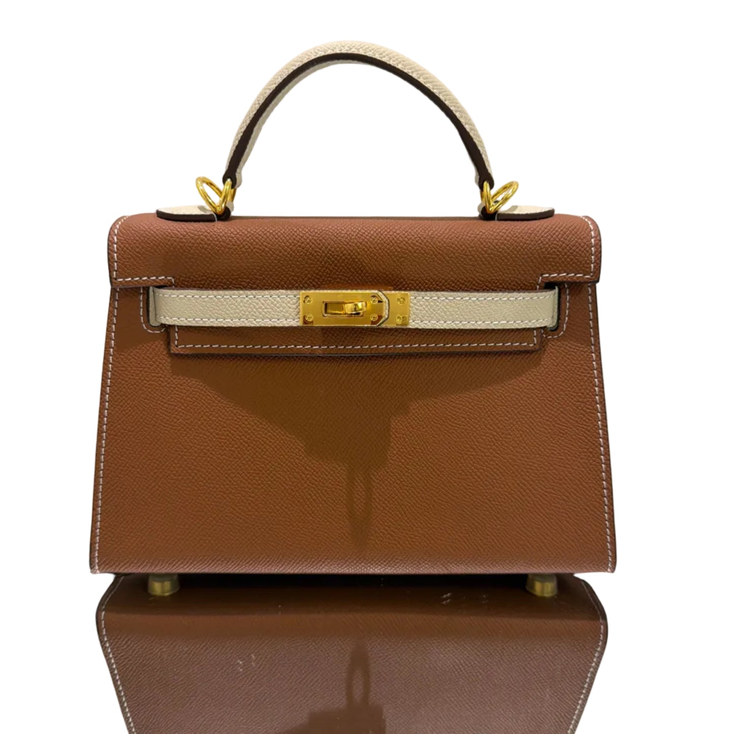 Brown handbag with gold accents on a light gray background