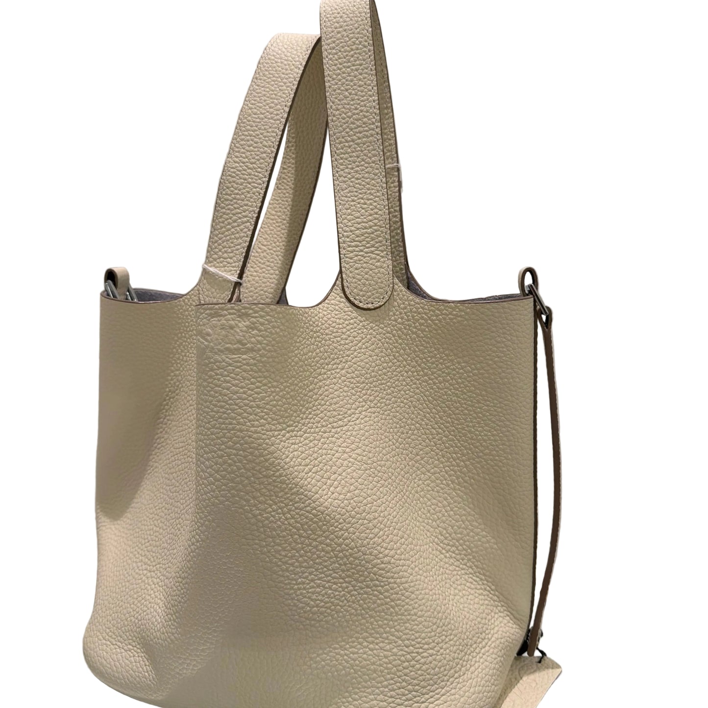 Beige leather handbag on a white background