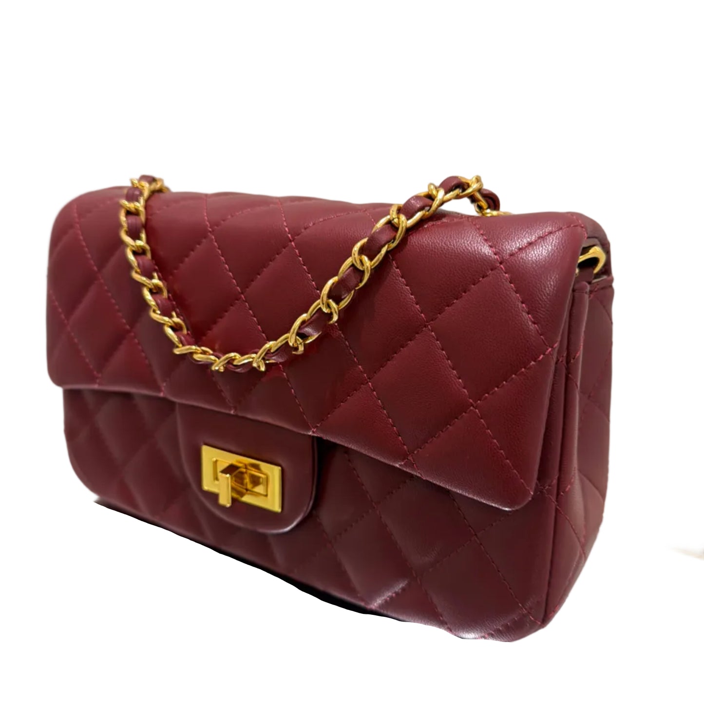 Maroon quilted handbag with gold chain and clasp on a light background