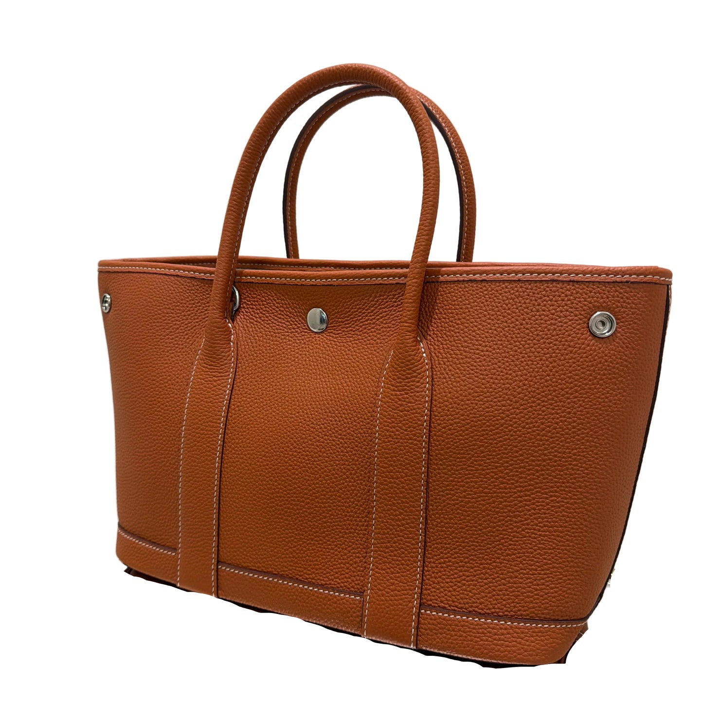 Brown leather bag on a white surface