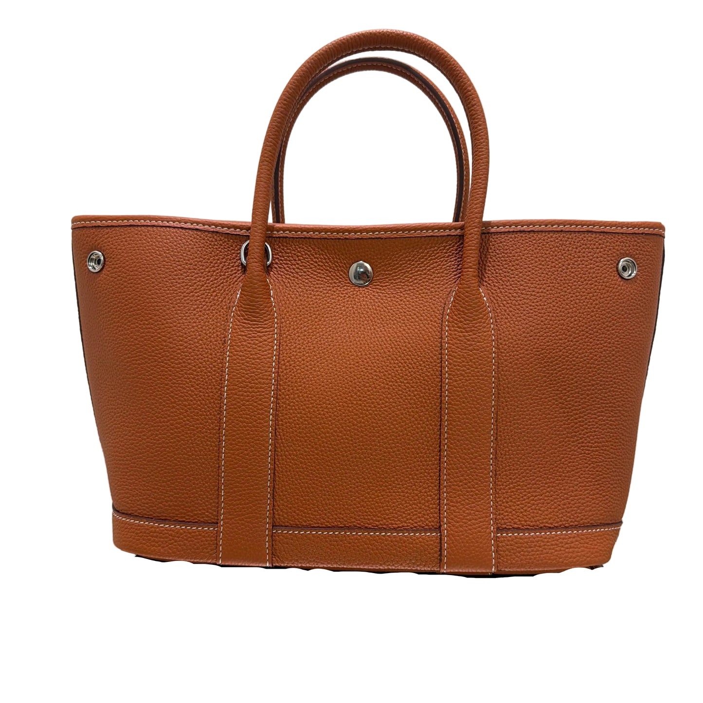 Brown leather handbag with visible stitching on a white background