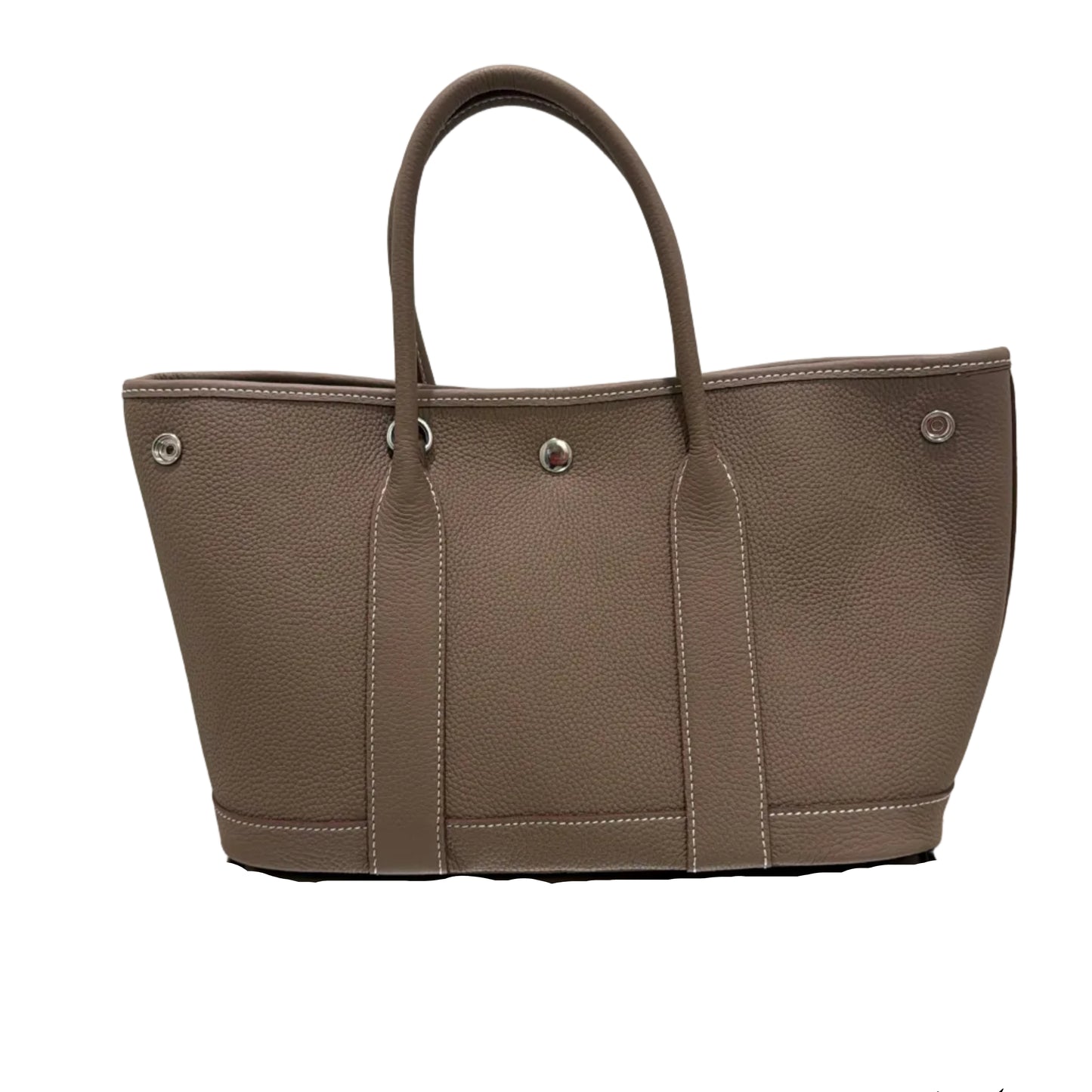 Brown leather handbag with a mirror reflection on a white background