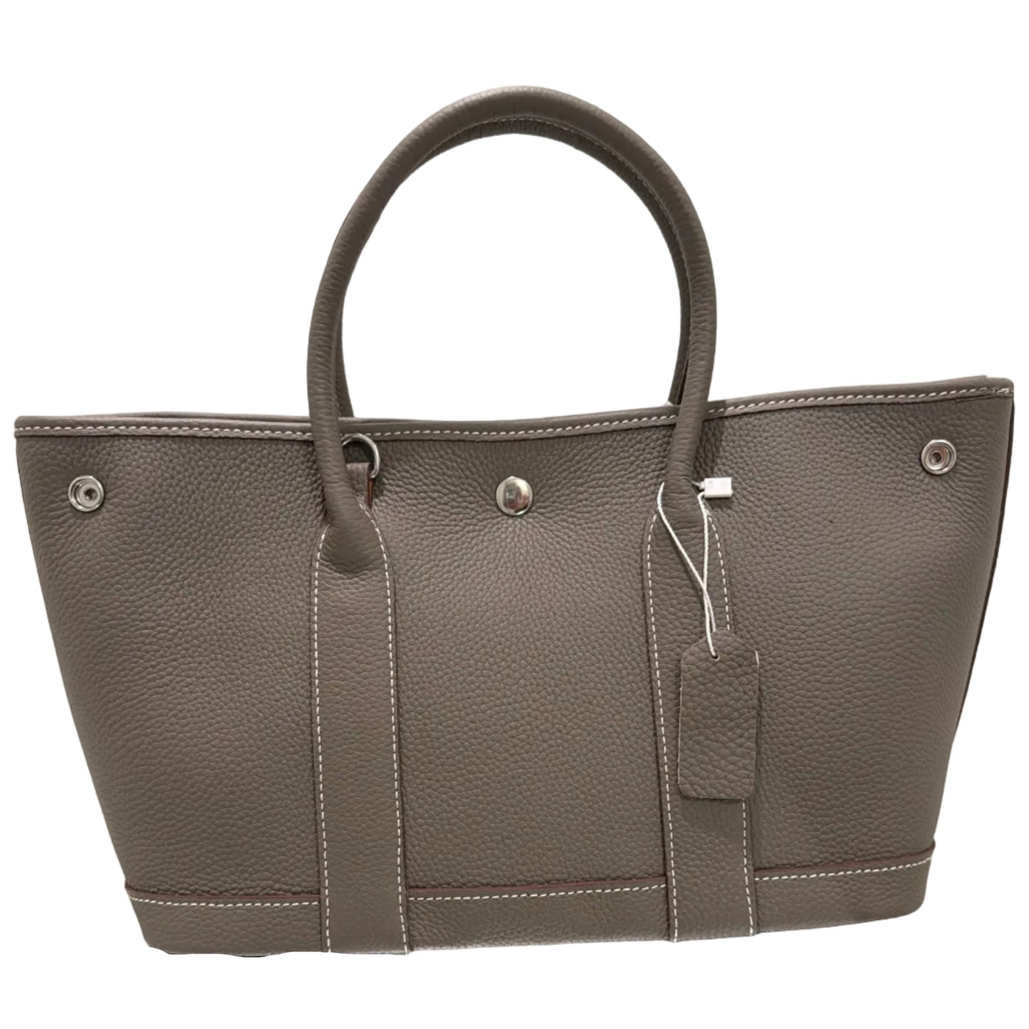 Gray leather briefcase with a mirror reflection on a light background