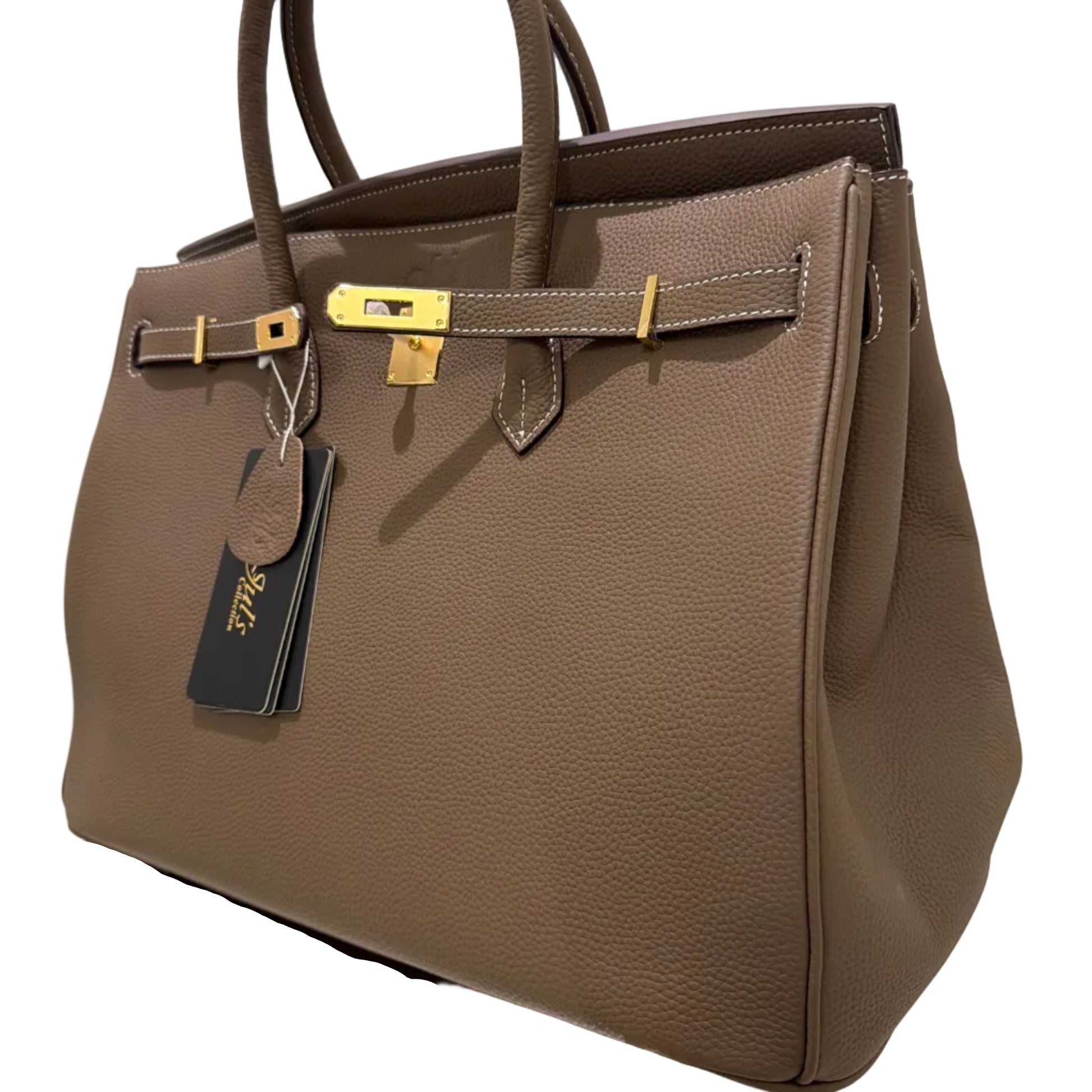 Brown leather bag with gold hardware on a white background