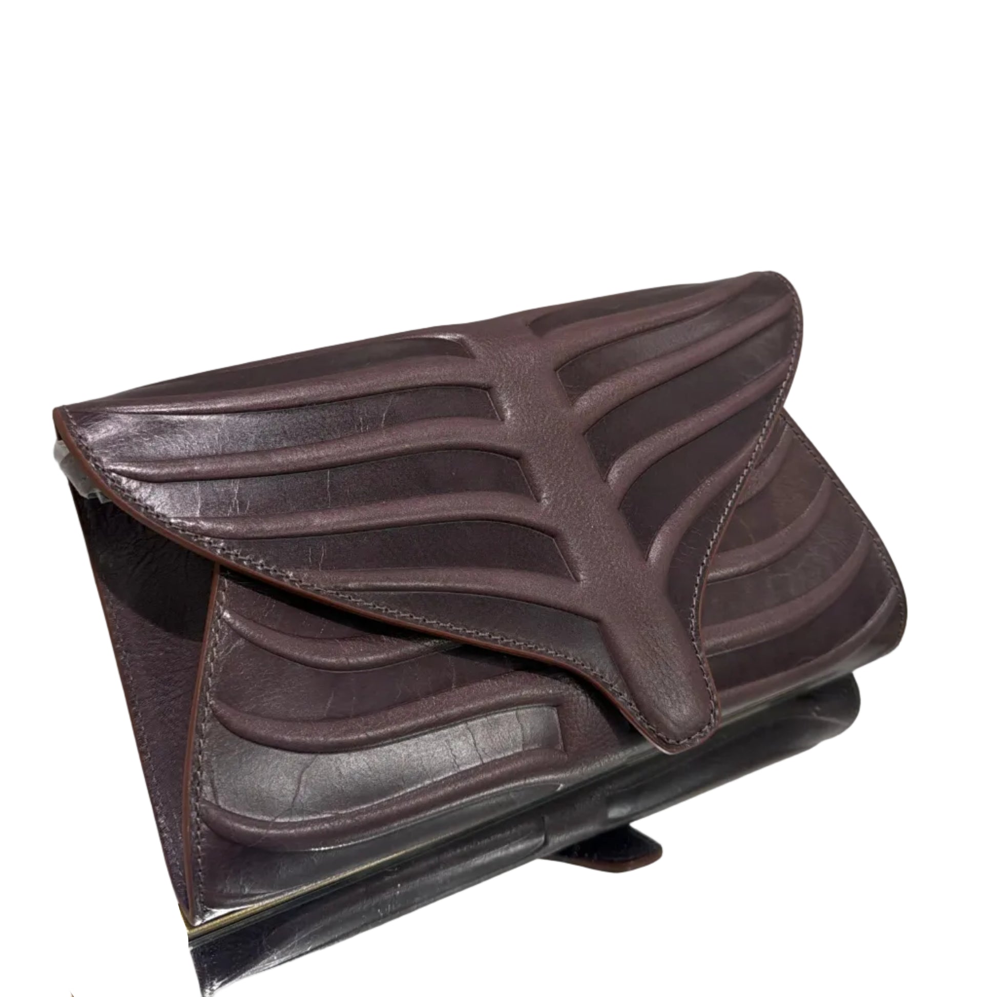 Brown leather wallet on a white surface