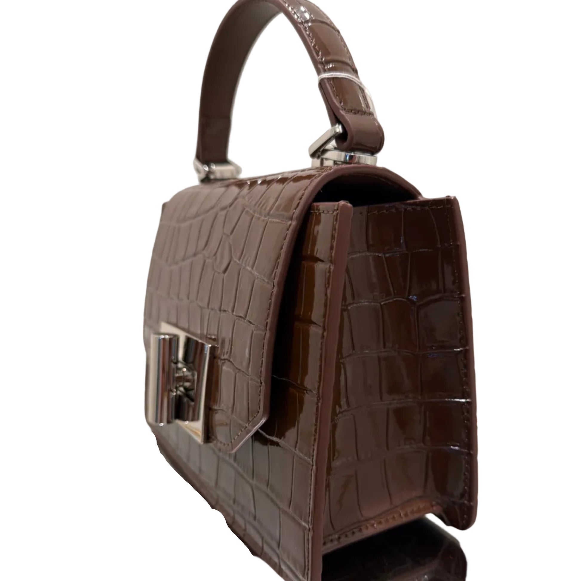 Brown crocodile-patterned handbag on a white surface