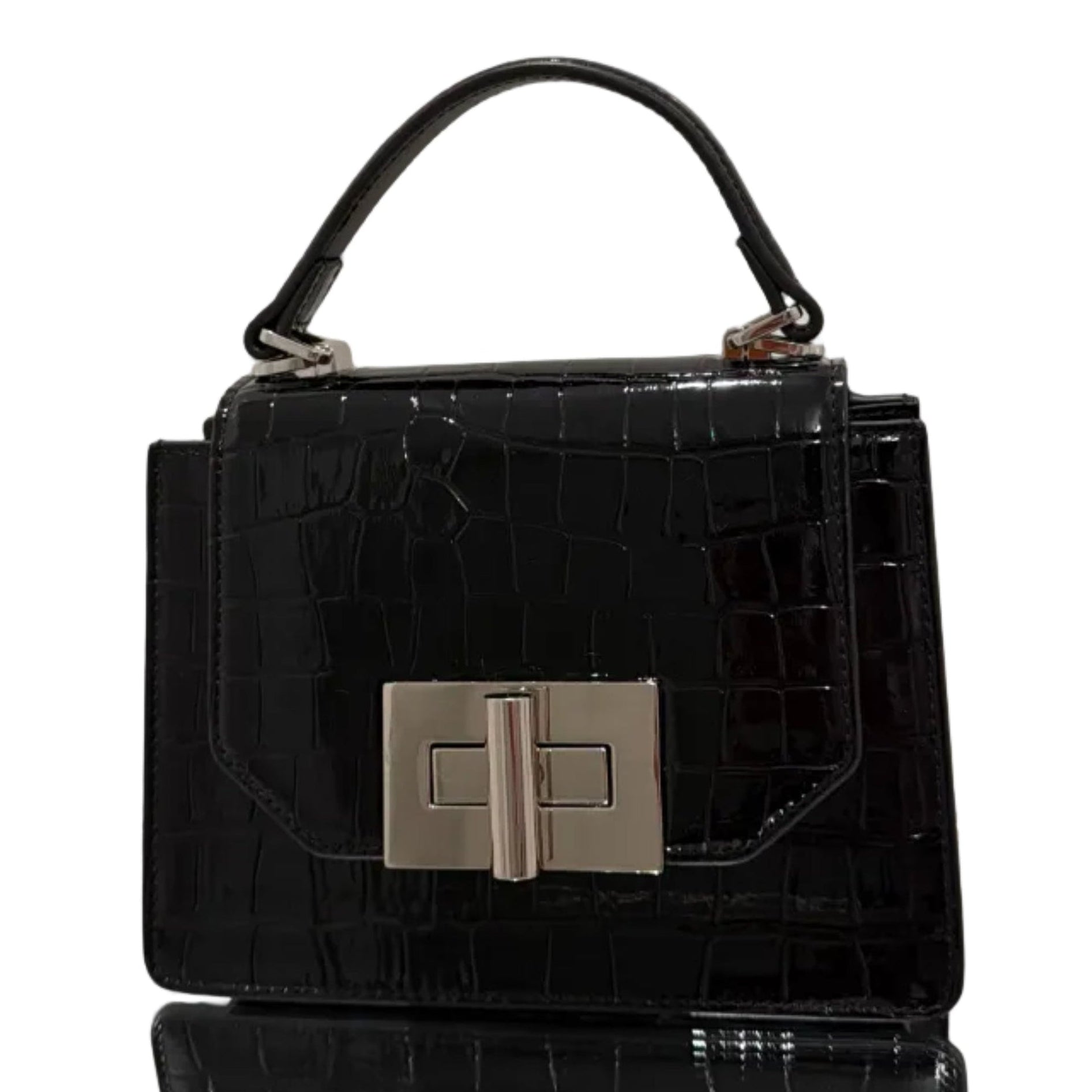 Black crocodile-patterned handbag with silver clasp on a light gray background