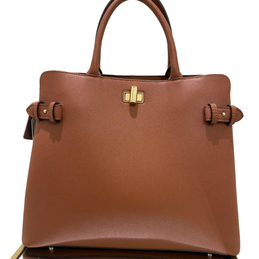 Brown leather handbag with gold clasp on a light gray background