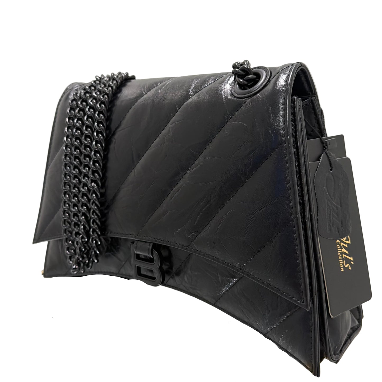 Black quilted handbag with studded details on a white surface