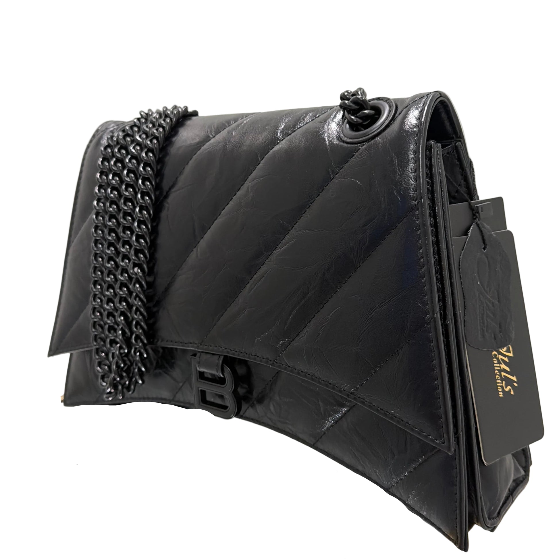 Black quilted handbag with studded details on a white surface