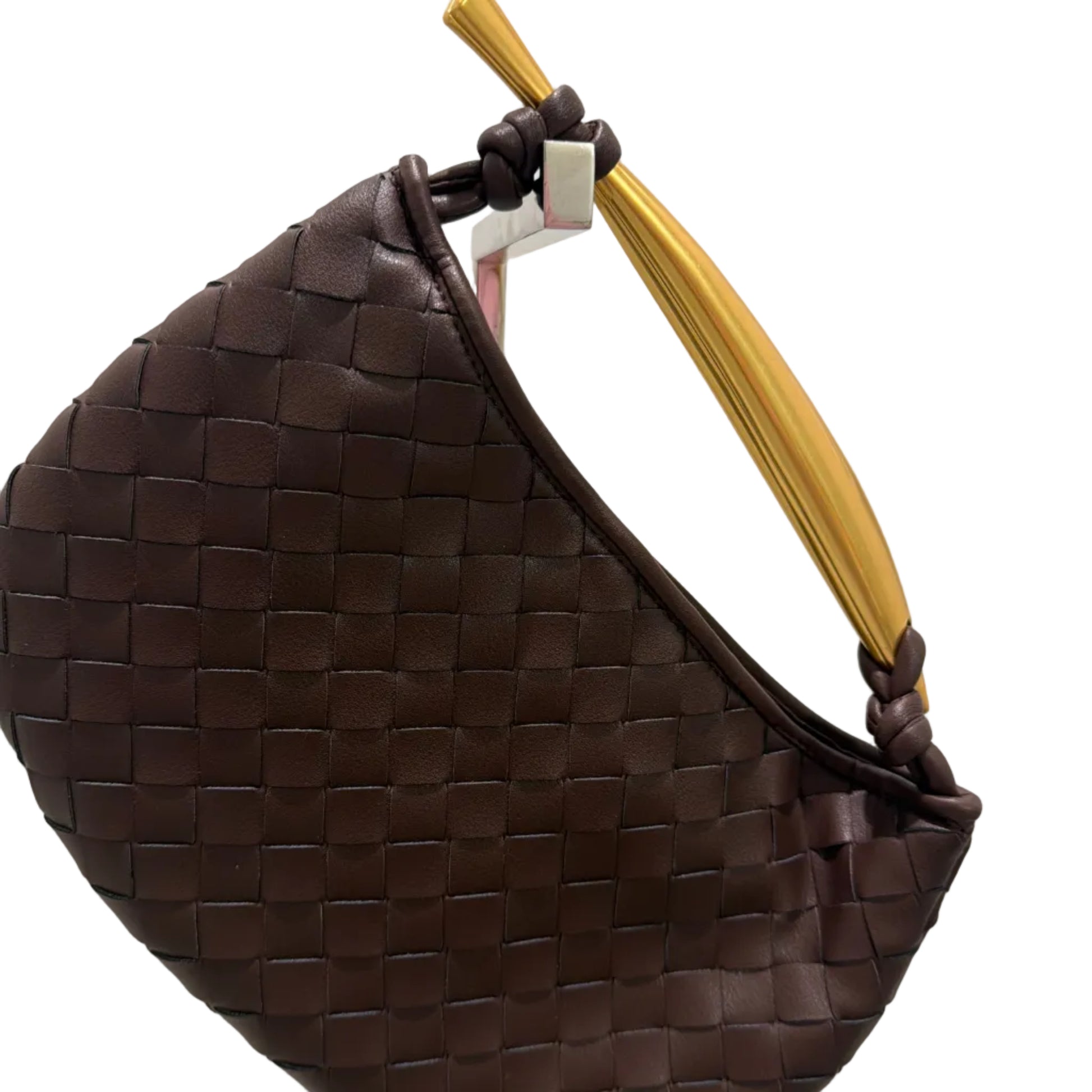 Brown woven handbag with a gold handle on a white background